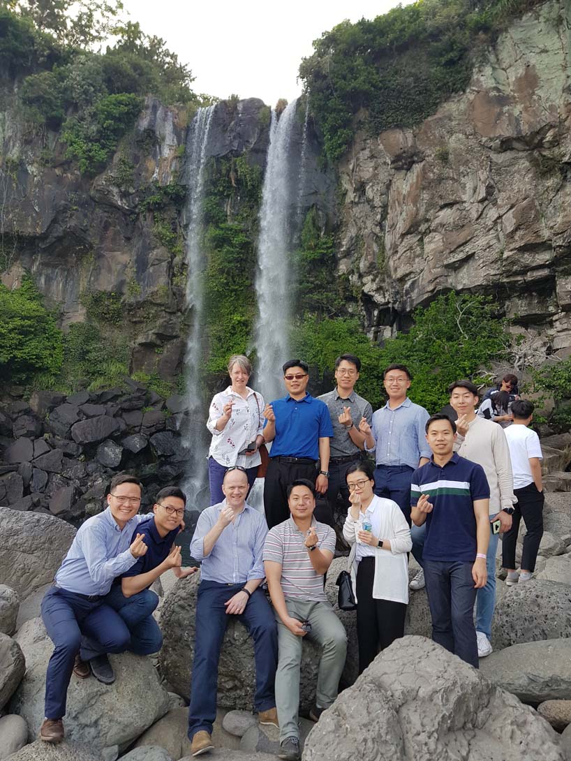 Royal Navy Officers in front of a waterfall