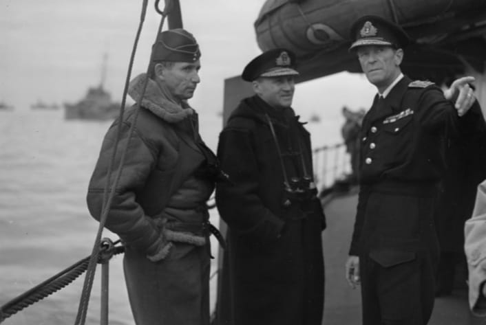 Admiral Ramsay (centre) with the RAF's Sir Arthur Tedder (left) and Rear Admiral Sir Philip Vian (pointing) aboard HMS Kelvin off Normandy