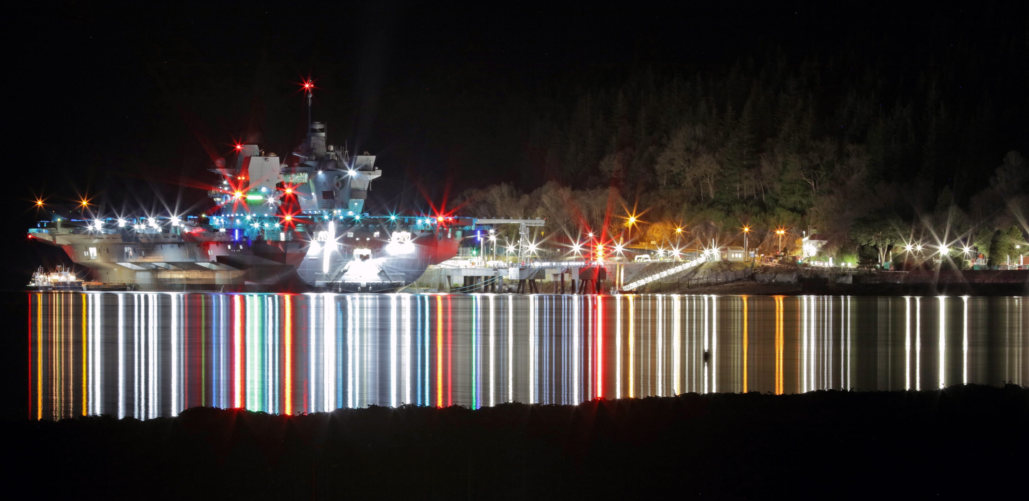 The magnificent sight of HMS Queen Elizabeth lit up at night at the refurbished Glenmallan Jetty on Loch Long The magnificent sight of HMS Queen Elizabeth lit up at night at the refurbished Glenmallan Jetty on Loch Long