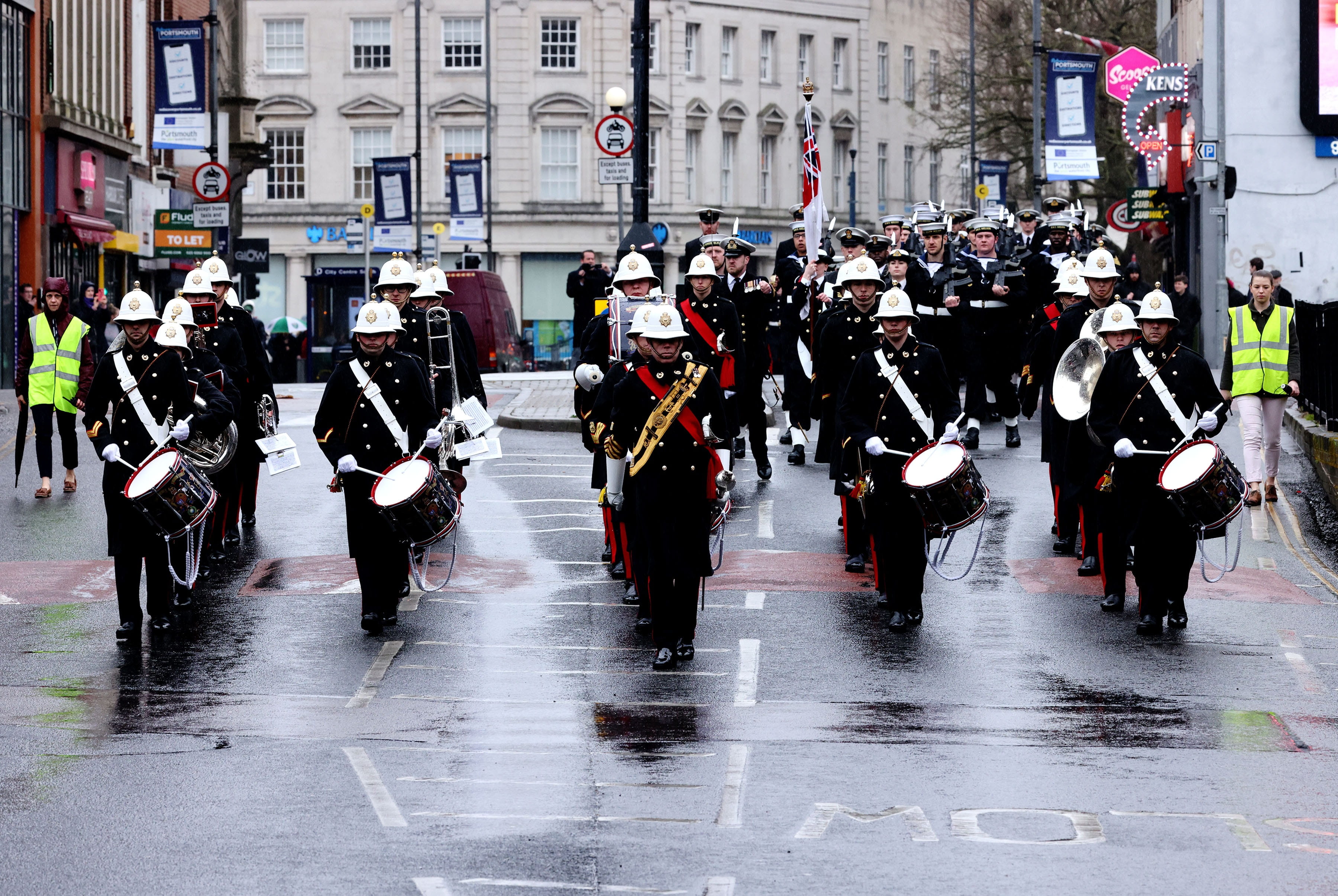 Personnel exercise their right to march through Portsmouth