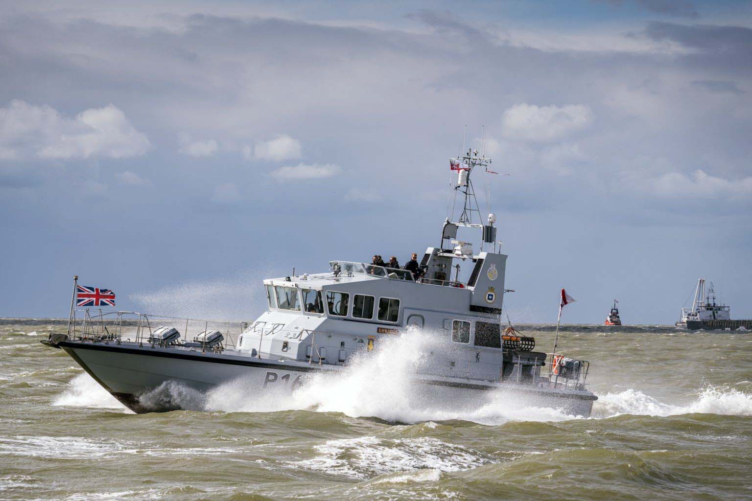 HMS Exploit throws up spray as she moves at speed through the North Sea just off Zeebrugge