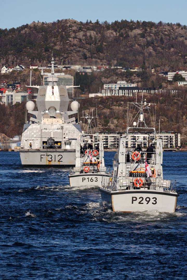 HMS Express and Ranger follow HNoMS Otto Sverdrup up a fjord