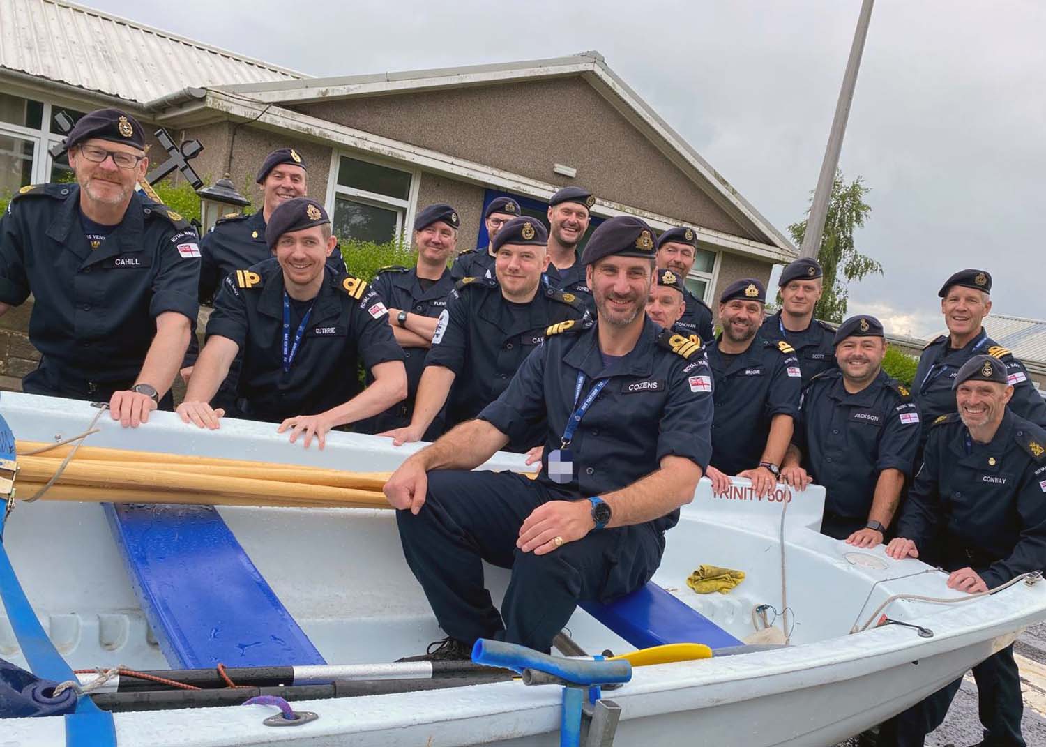 HMS Venturers sailors give Senior Naval Officer Cdr Chris Cozens a traditional sendoff