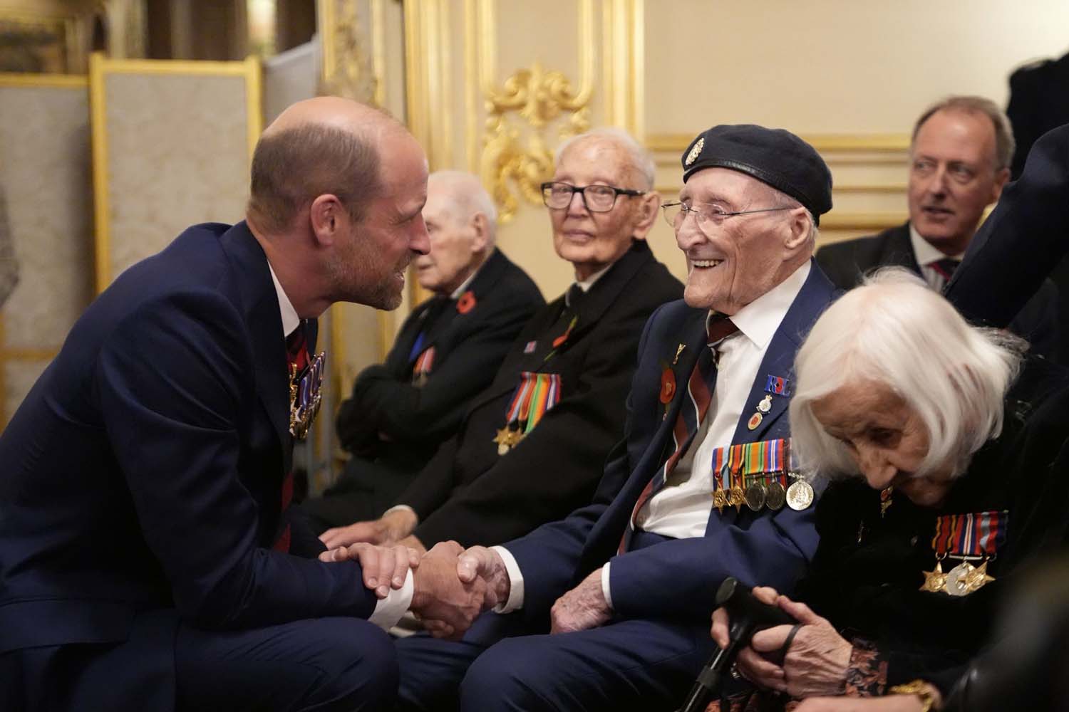 Prince of Wales meeting veterans during a reception at Windsor Castle