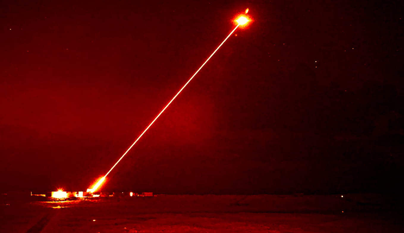 Dragonfire lights up the night as it targets a drone during a midnight interception