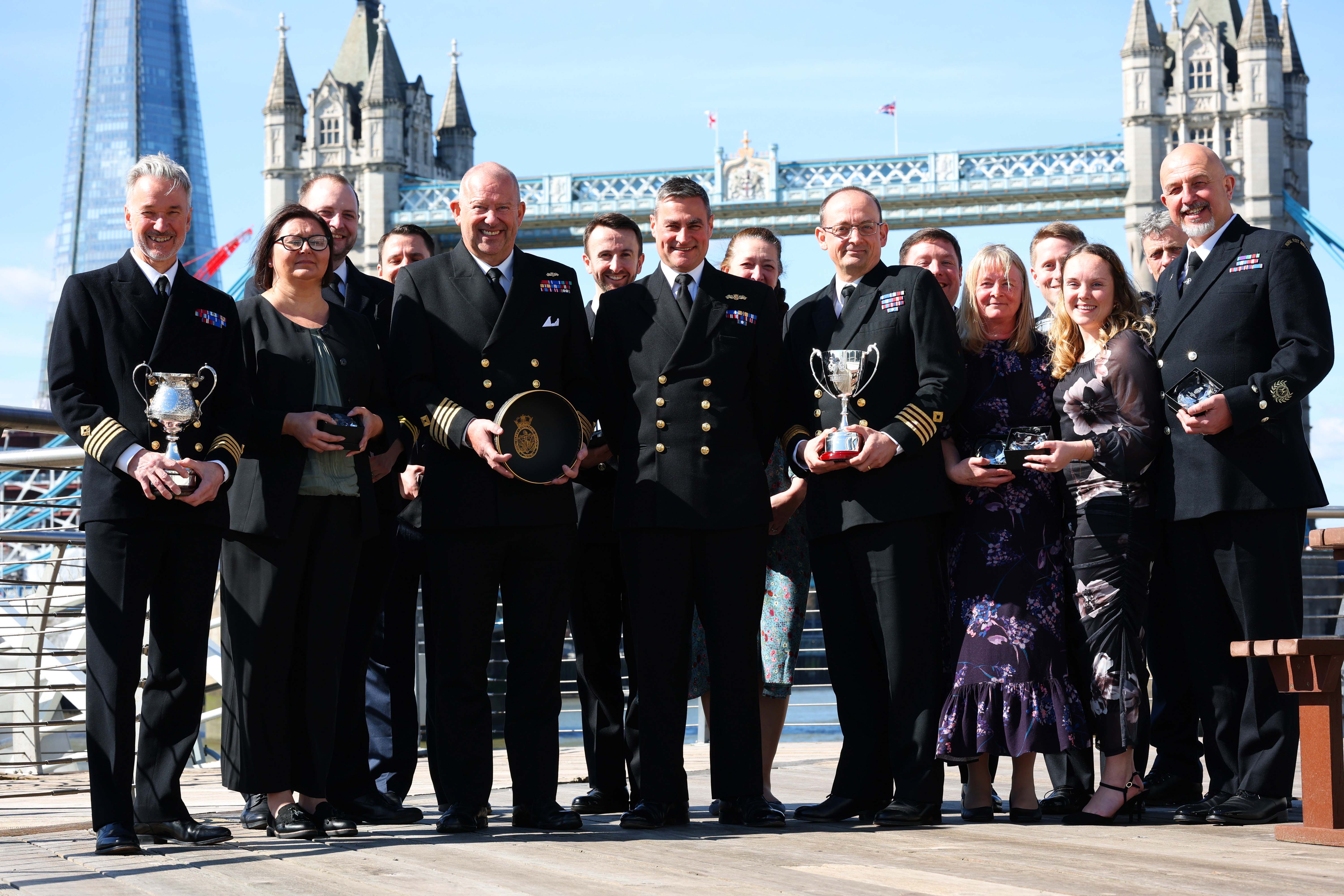 The RFA Awards winners pose with their trophies against the backdrop of Tower Bridge