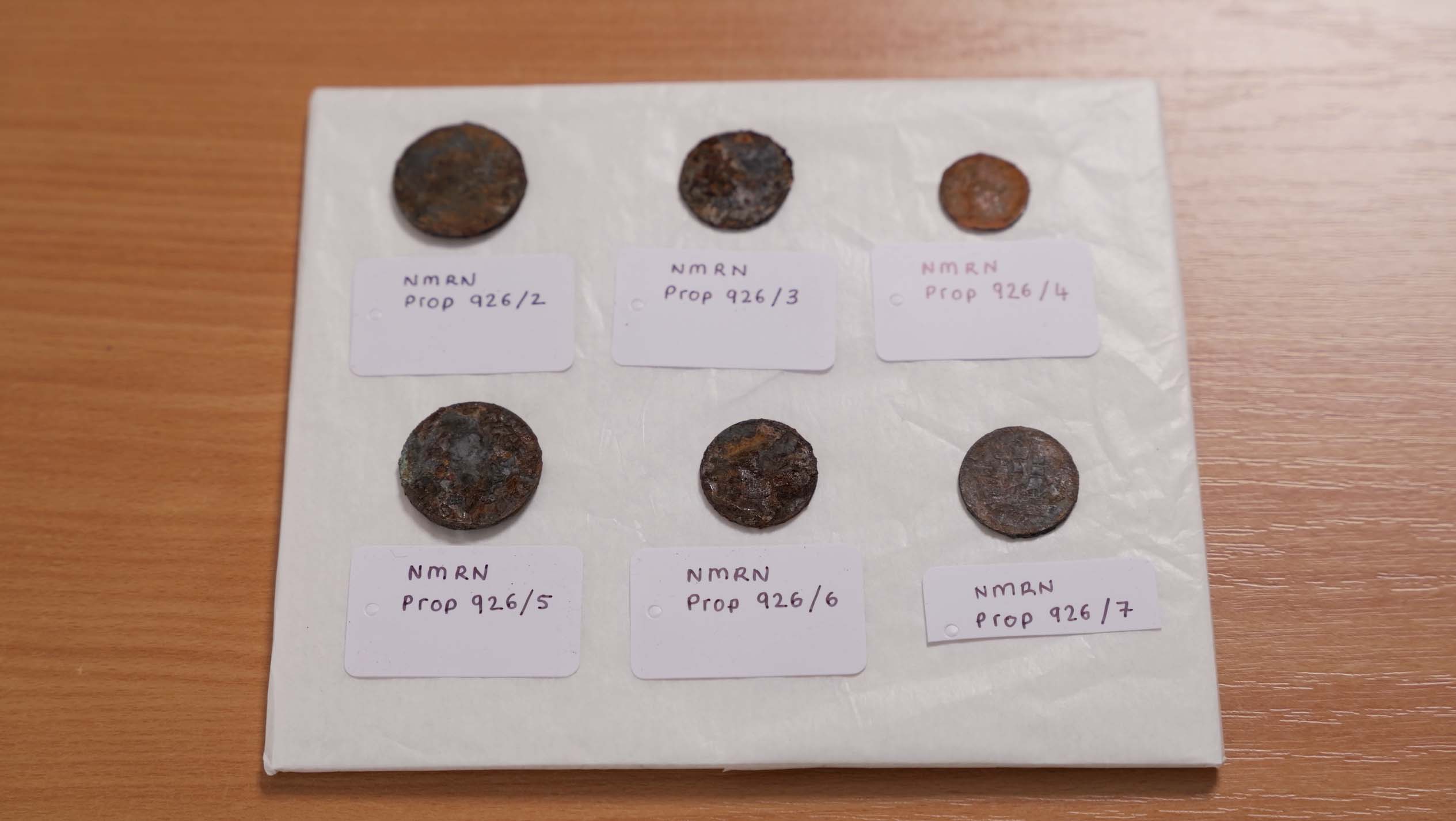 Close up of the 19th-century coins discovered beneath the foremast of HMS Victory 