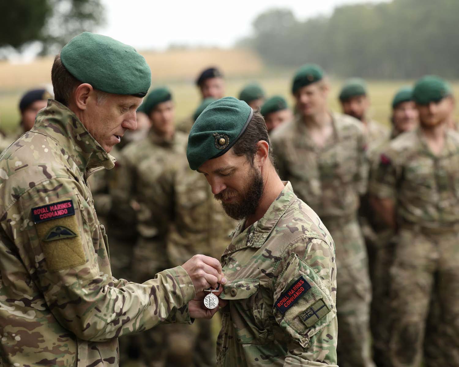 COMOPS Major General Rich Cantrill presents Sgt 'Robbo' Robinson with a temporary King's Medal