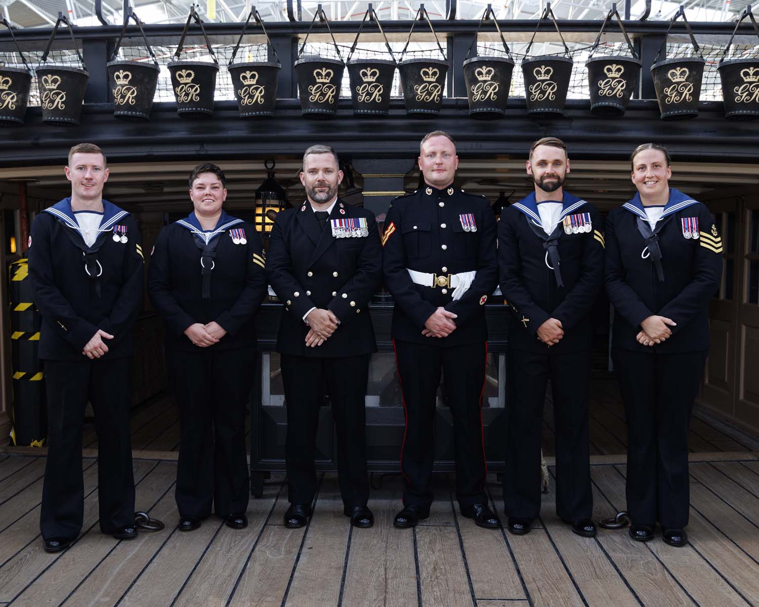 The six successful paramedics aboard HMS Victory