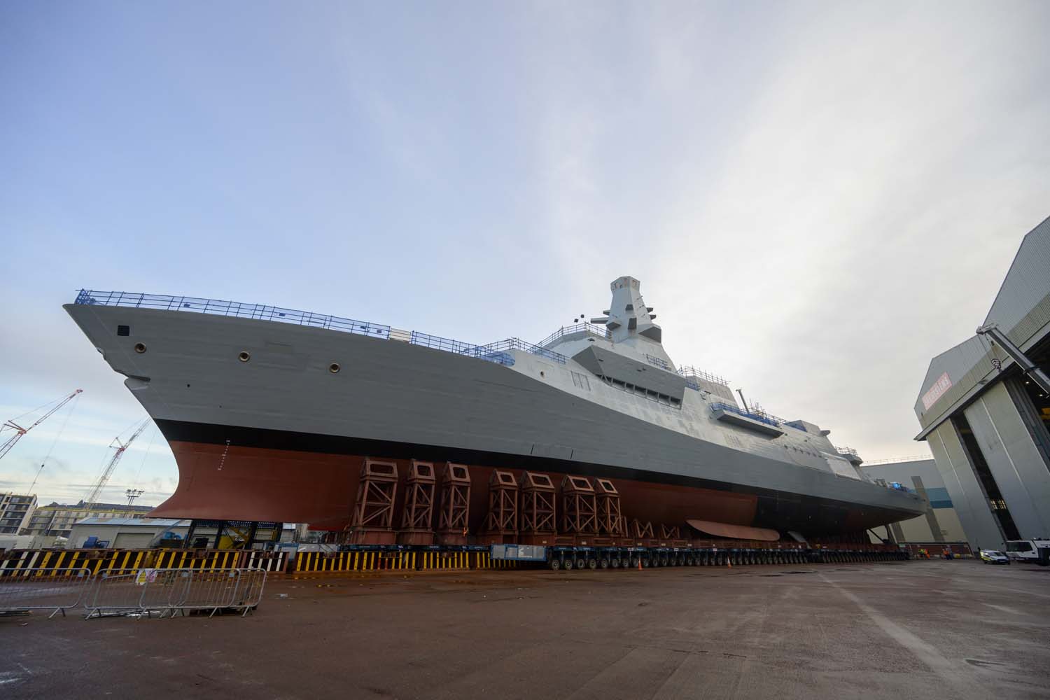 HMS Glasgow will enter the water for the first time as she's lowered onto a barge to start the next phase of her build. Picture: BAE Systems