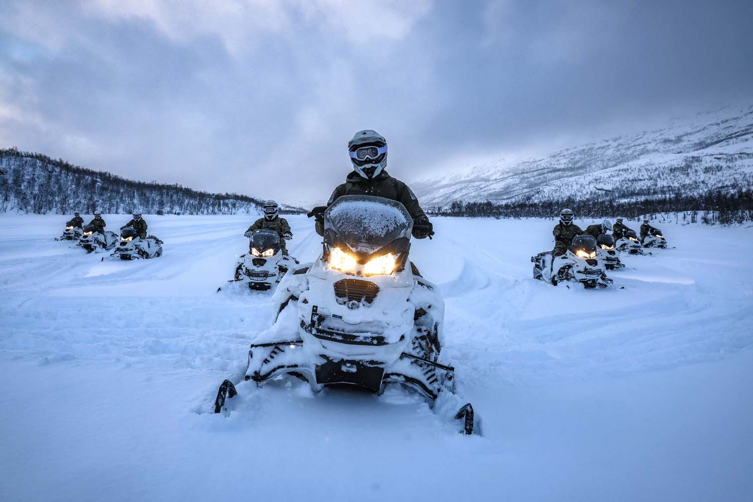 Snowmobiles in action in the arctic