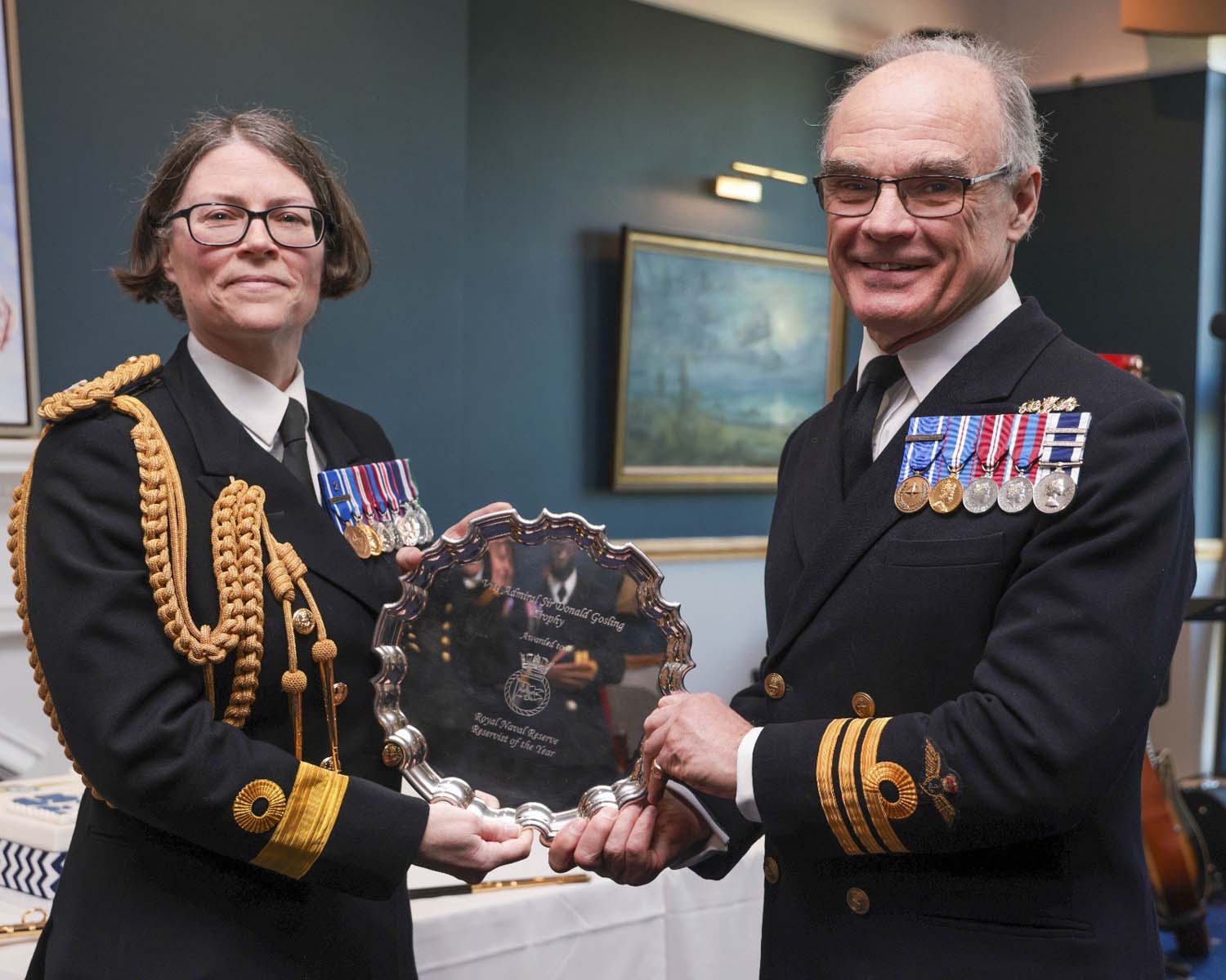 Cdre Adey presents Lt Cdr Jonnie Barnes-Yallowley with his trophy