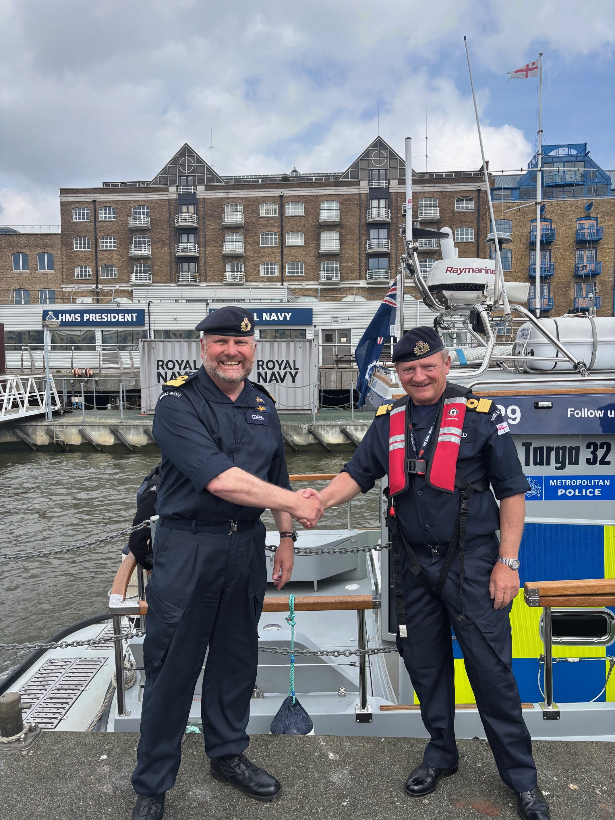 Commodore Bellfield (right) hands over to Commodore Green (left)