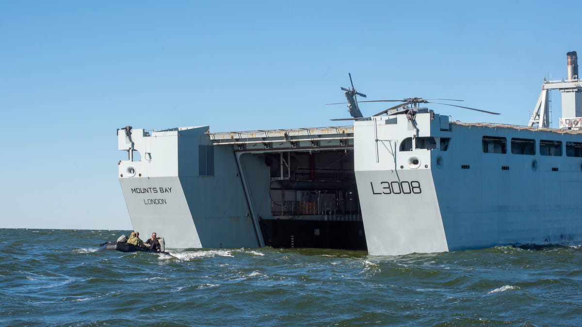 Sailors assigned to Explosive Ordnance Disposal Mobile Unit (EODMU) 2 get underway on a combat rubber raiding craft
