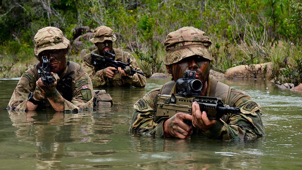 Marine John Allen of Alpha Company, 40 Commando Royal Marines with an Army Commando and a Marine patrolling in the river at Belize