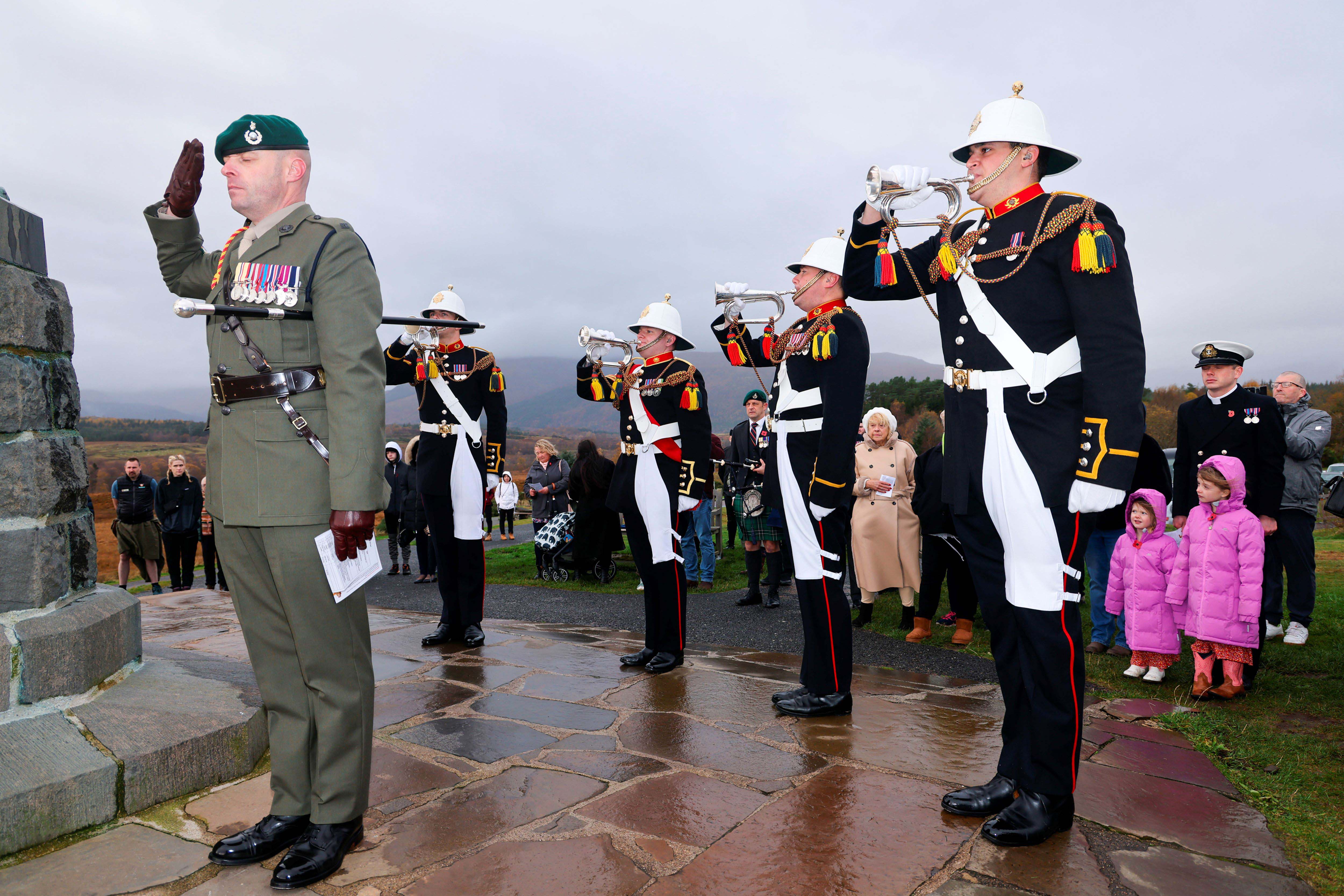 Buglers from the Band of the Royal Marines Scotland play during the service.