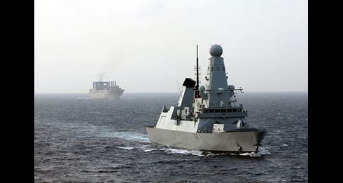 HMS Daring escorts the 62,000-tonne American military ferry/cargo ship USNS Brittin safely through ‘missile alley’