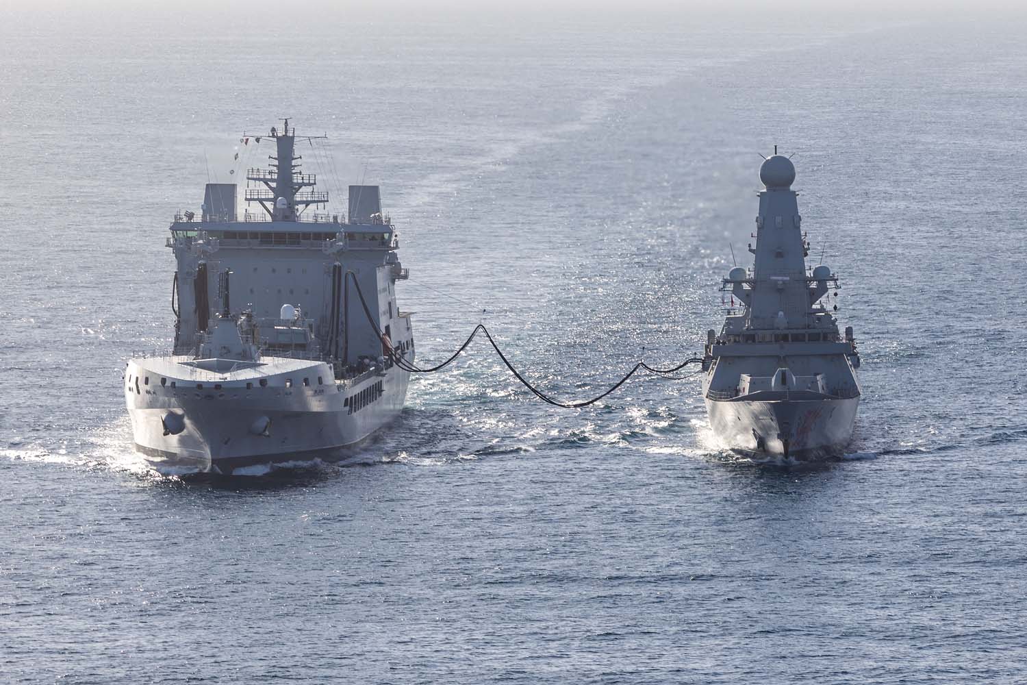 HMS Dragon conducting a Replenishment at Sea whilst undergoing Fleet Operational Standards and Training 