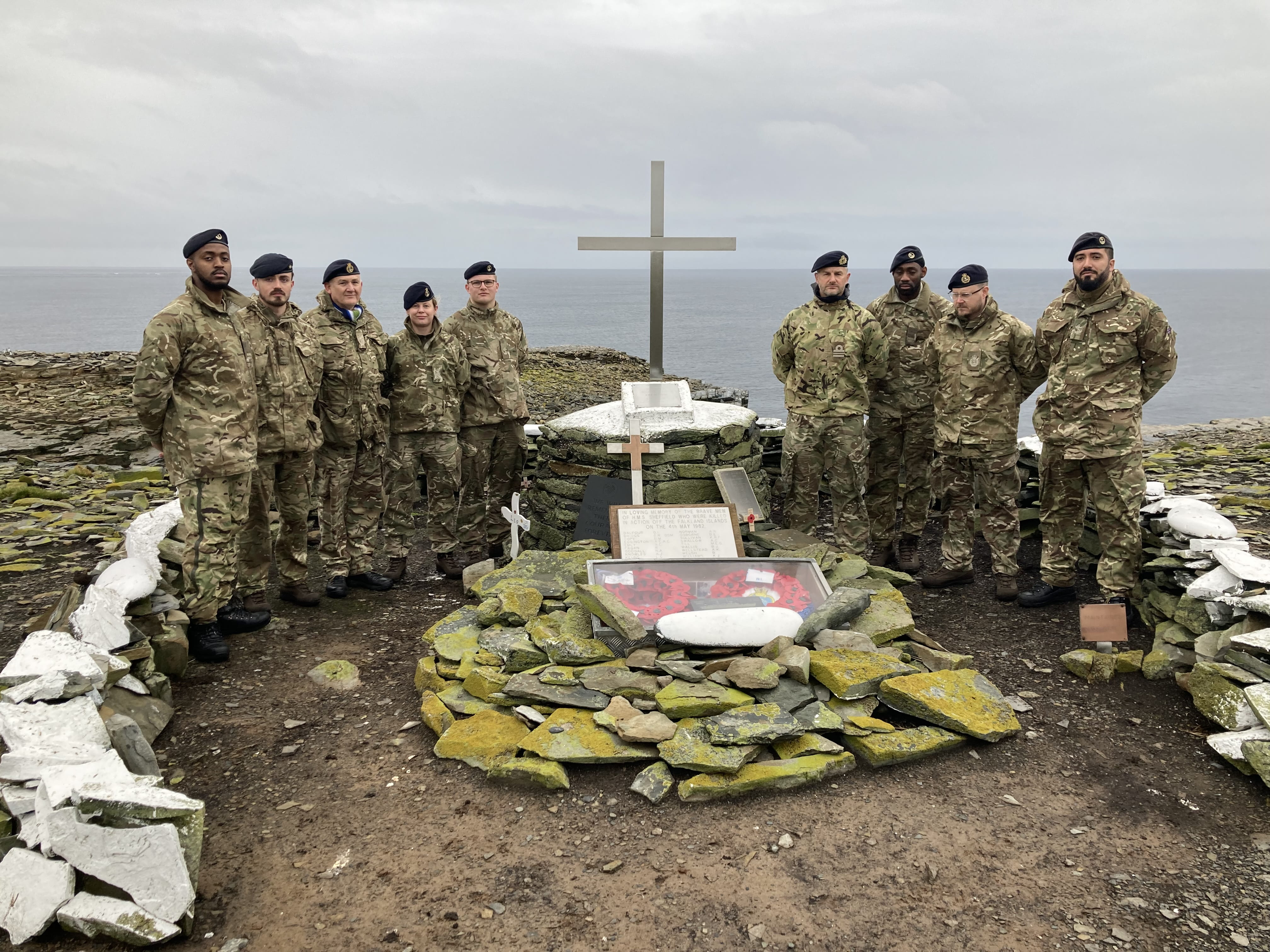 The NEFI team with the restored monument to HMS Sheffield on Sealion Island