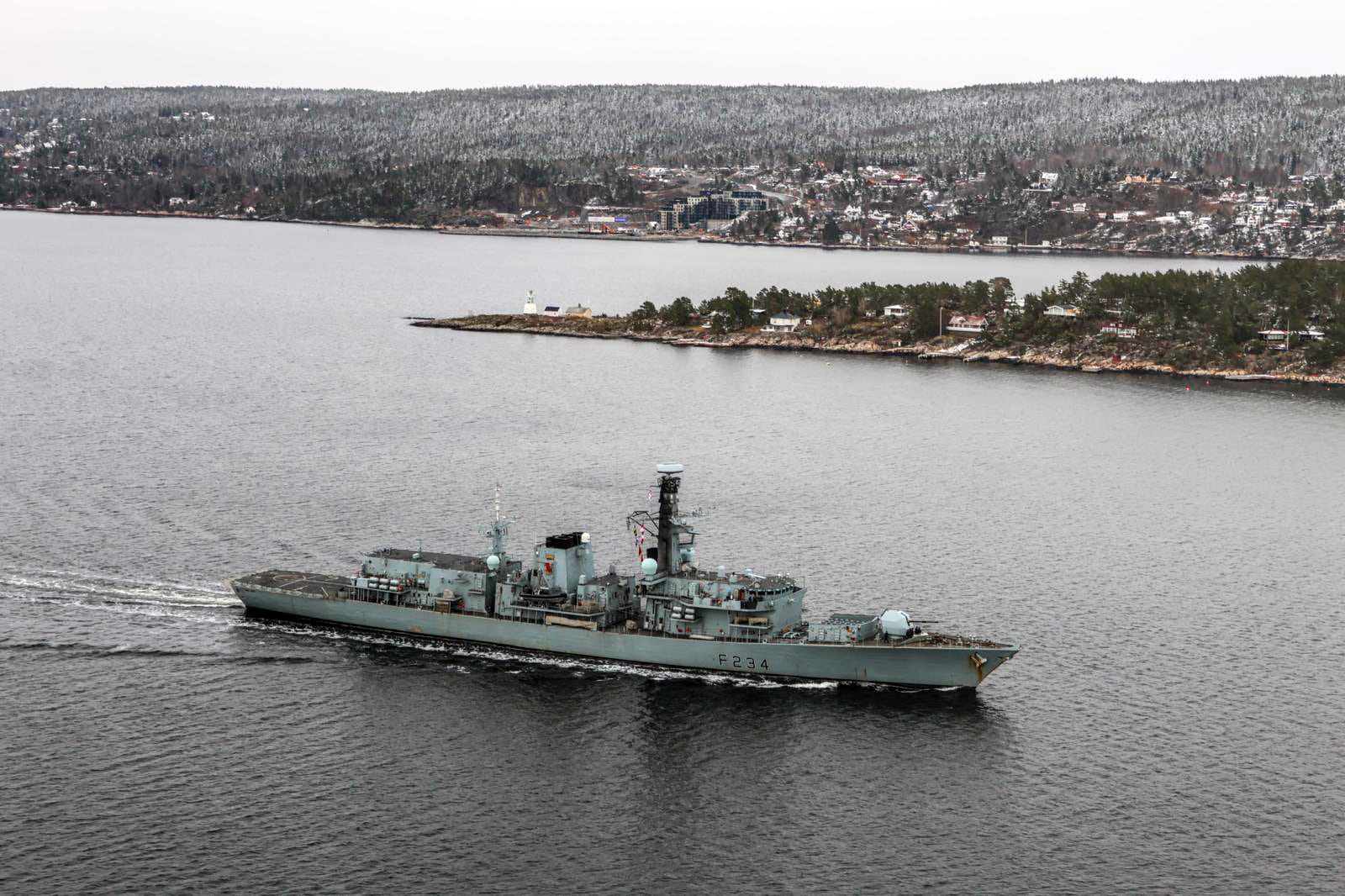 HMS Iron Duke passes the island of Søndre Langåra and the village of Nordre Spro HMS Iron Duke passes the island of Søndre Langåra and the village of Nordre Spro