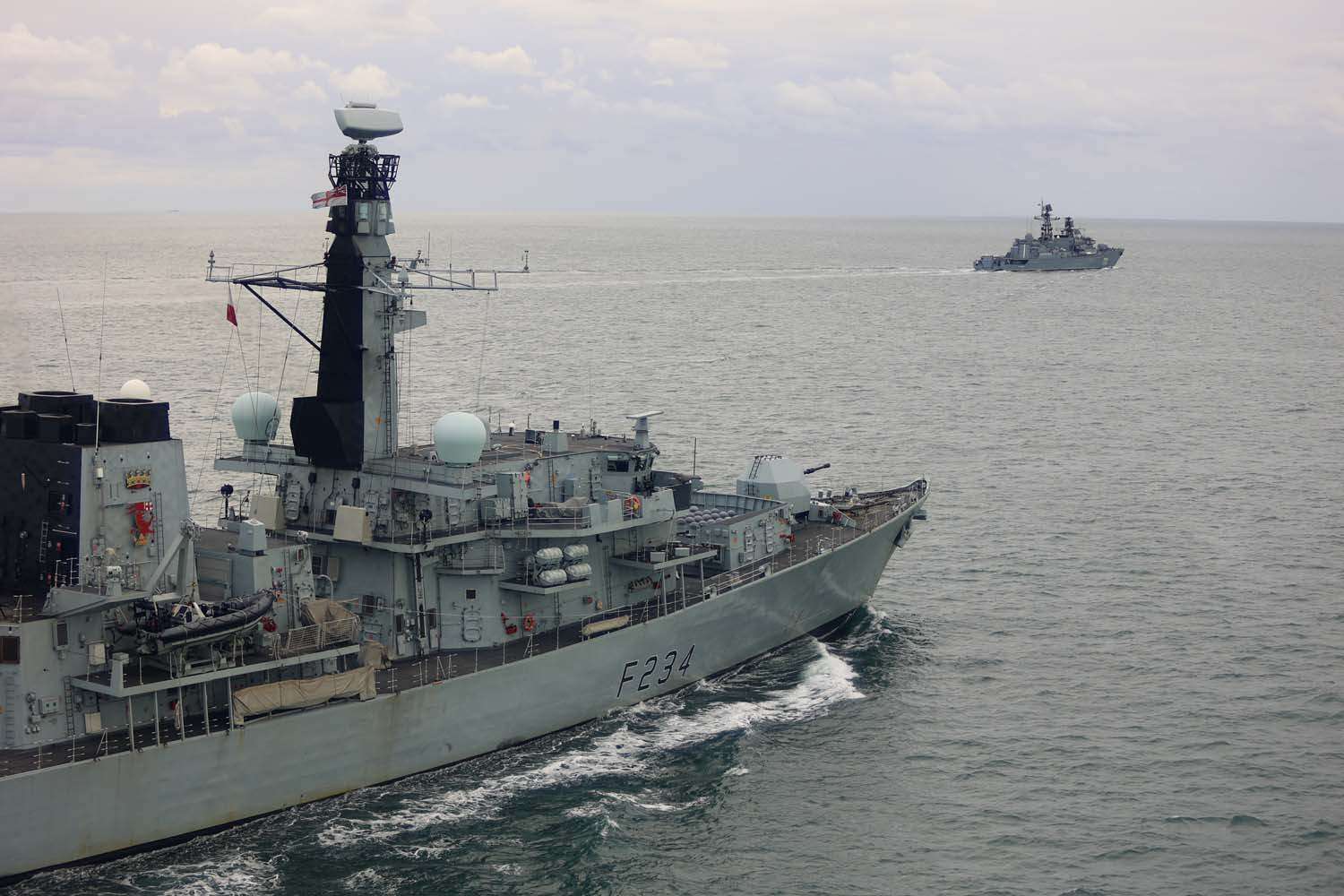 HMS Iron Duke tracks the progress of a Russian warship