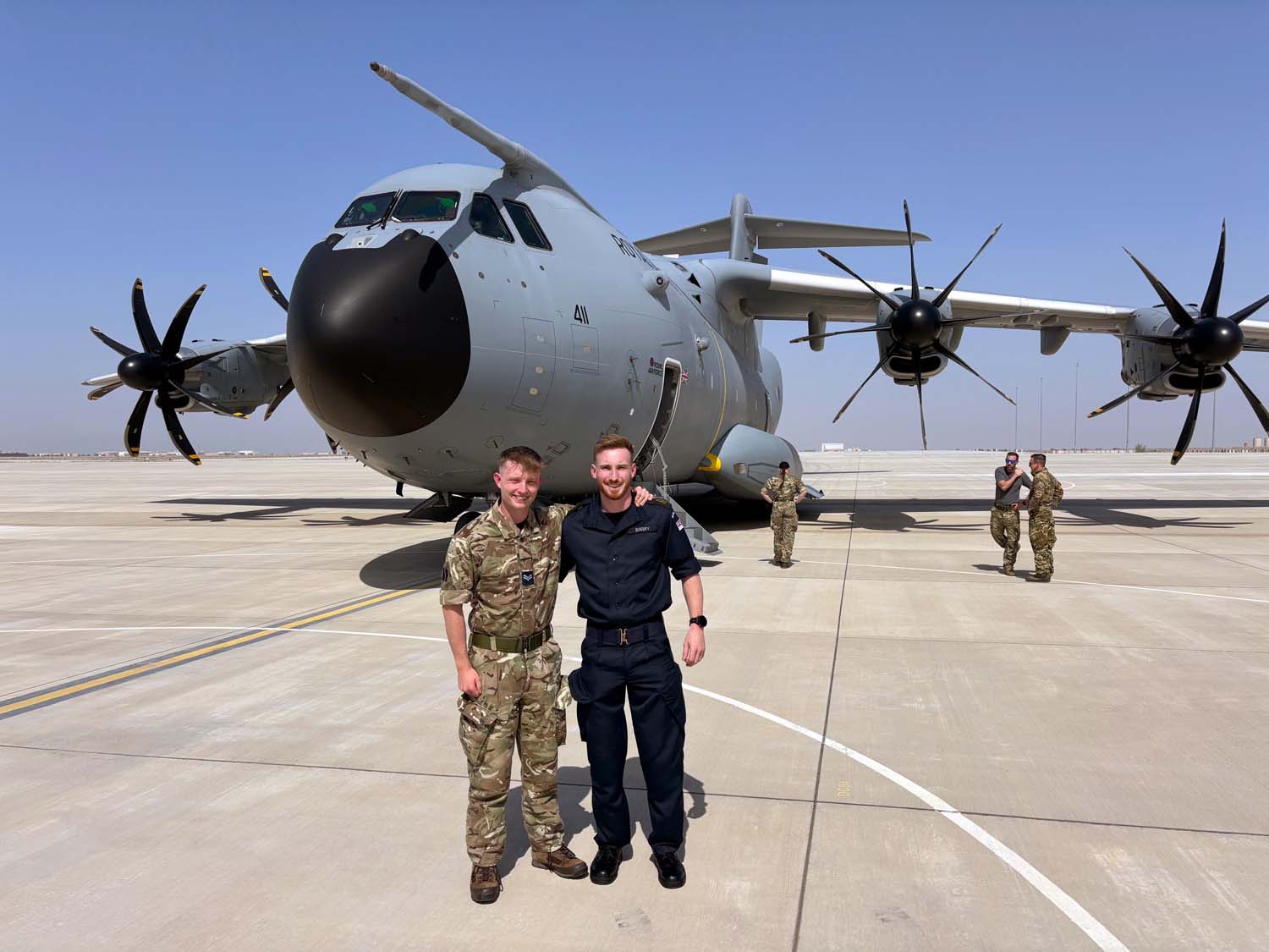 Cpl Alex and Petty Officer Andy Warry in front of the RAF A400M which delivered supplies for HMS Lancaster in the Gulf