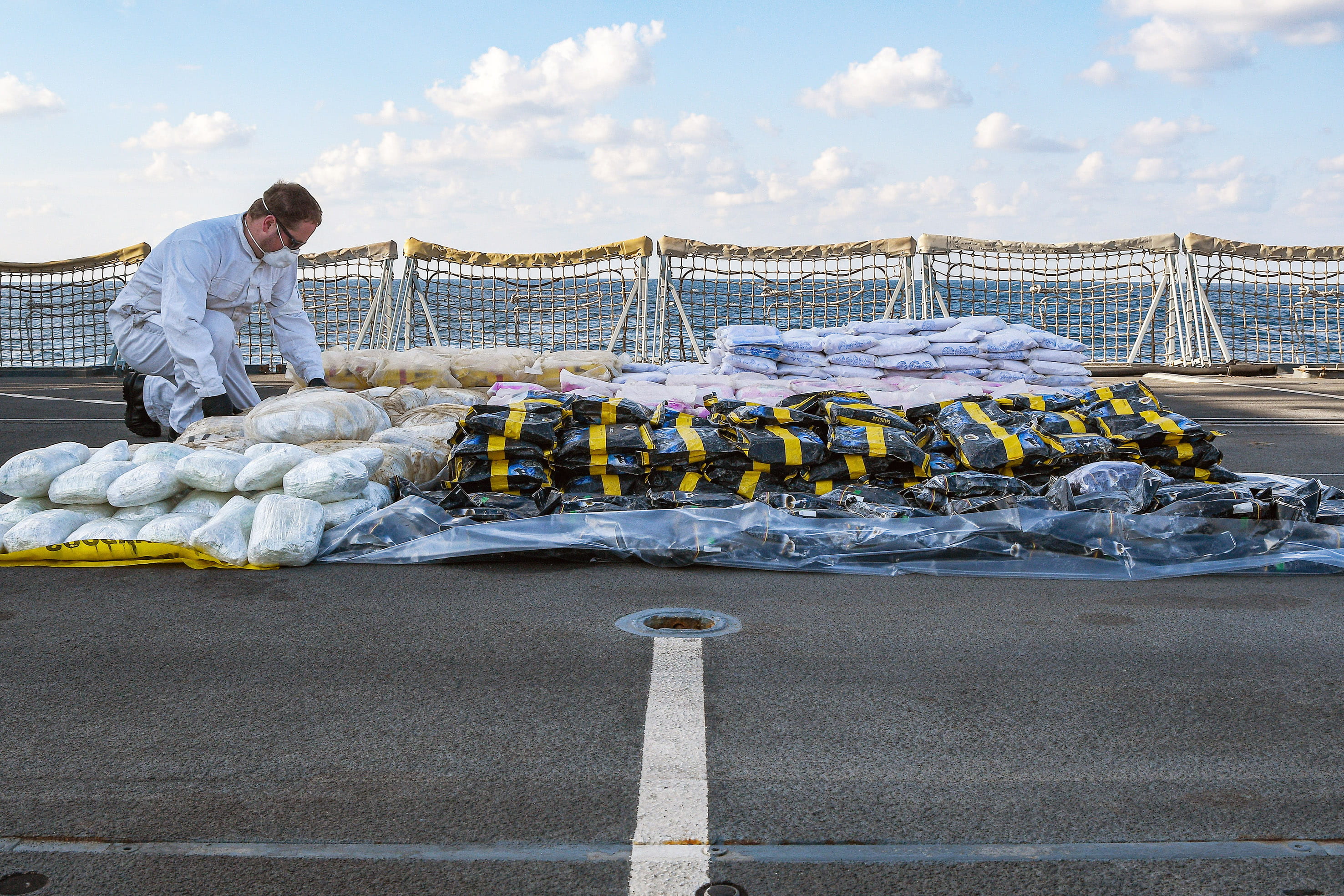 A sailor checks the impressive haul of drugs A sailor checks the impressive haul of drugs