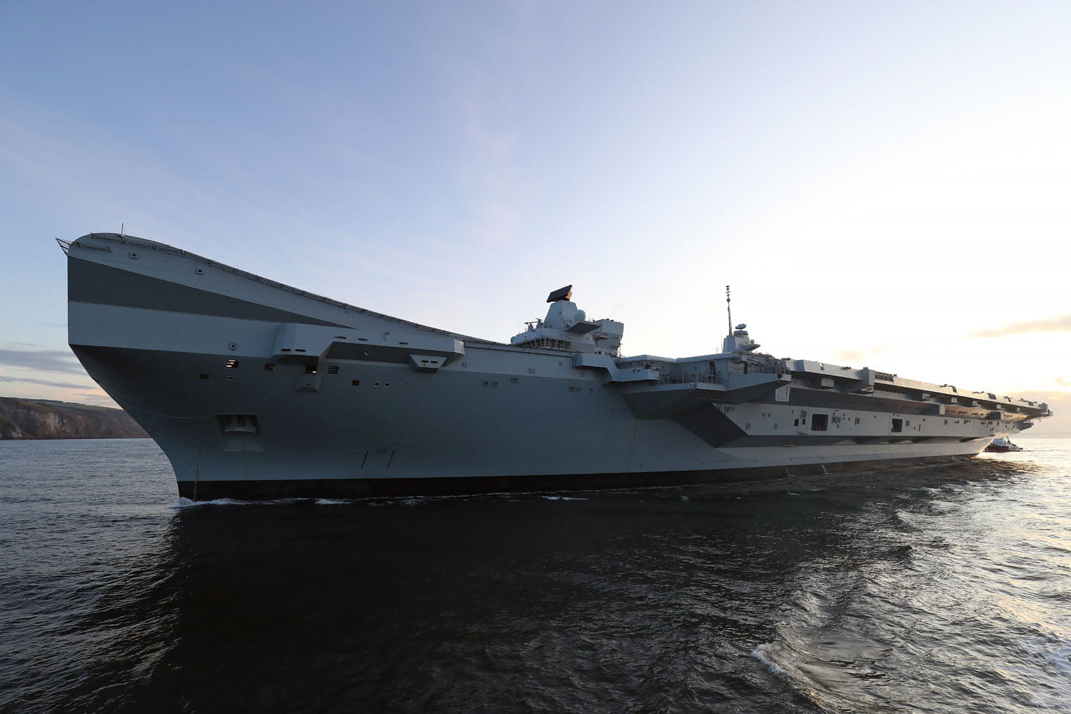 Tug of war(ship) as HMS Prince of Wales returns to Invergordon