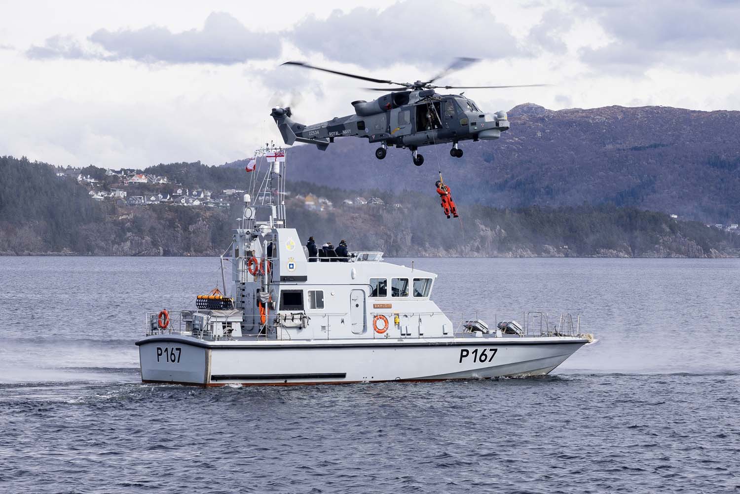 A Wildcat practices winching drills with HMS Exploit during Tamber Shield 2024