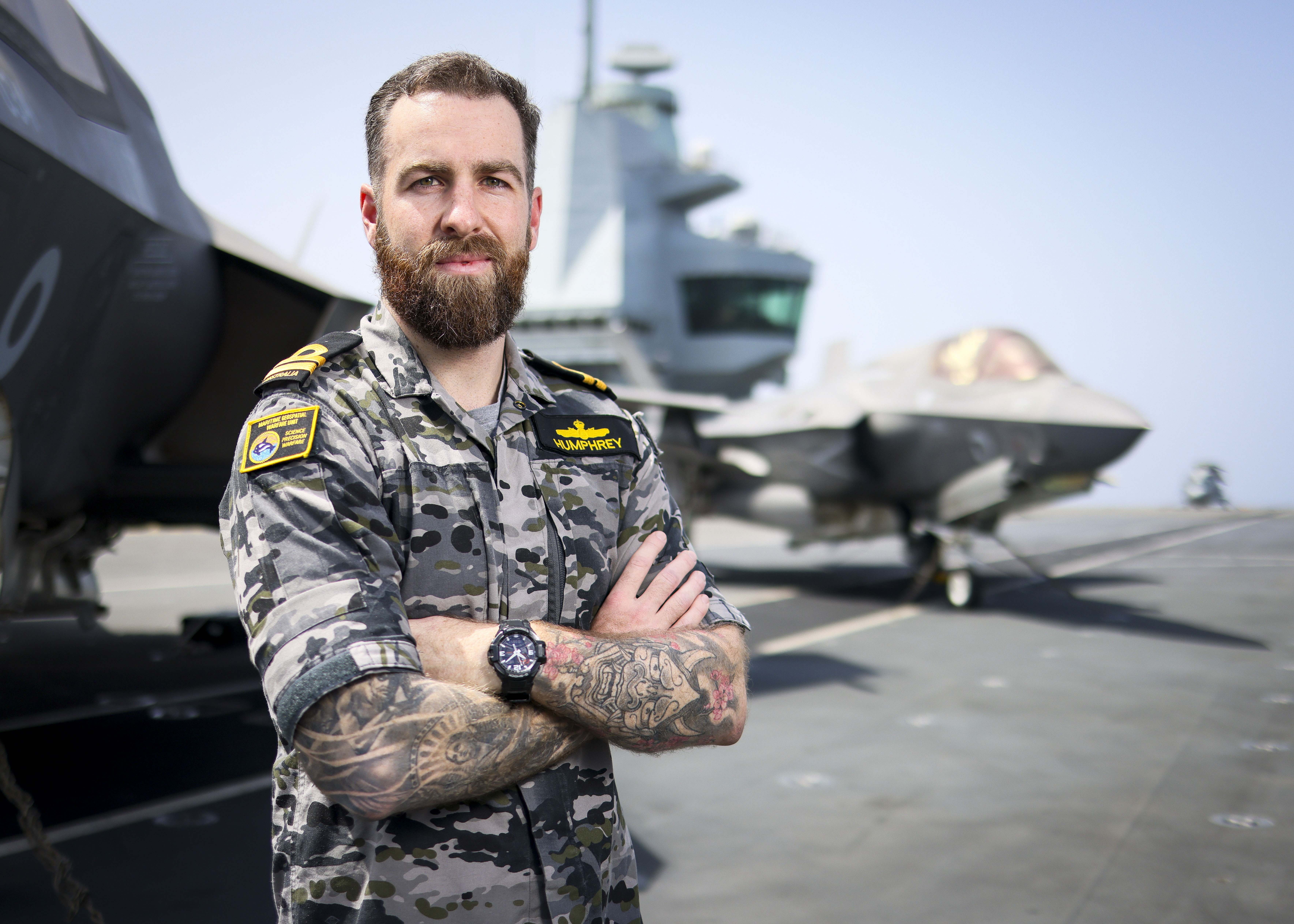 Portrait of Australian Meteorology and Oceanography Officer LEUT Liam Humphrey posing in MET Office onboard HMS Prince of Wales. This was taken on 04 June 2025.