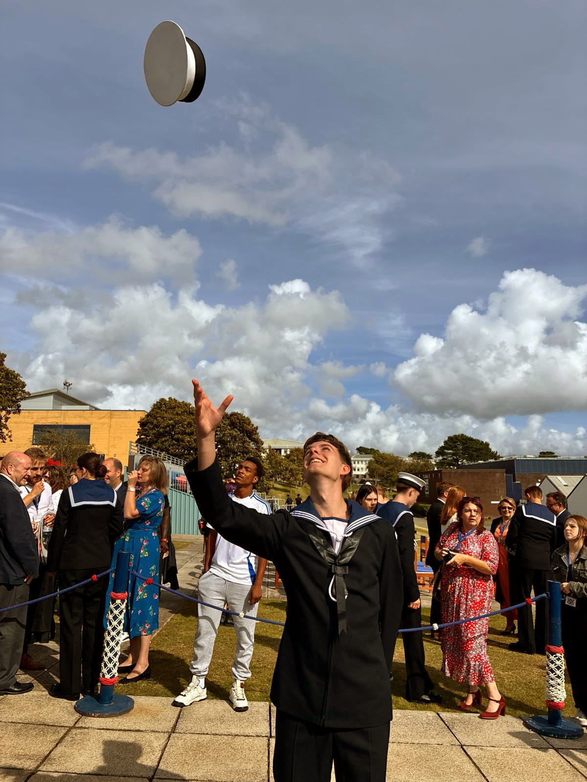 Alex Welsh celebrates passing out in traditional style at HMS Raleigh