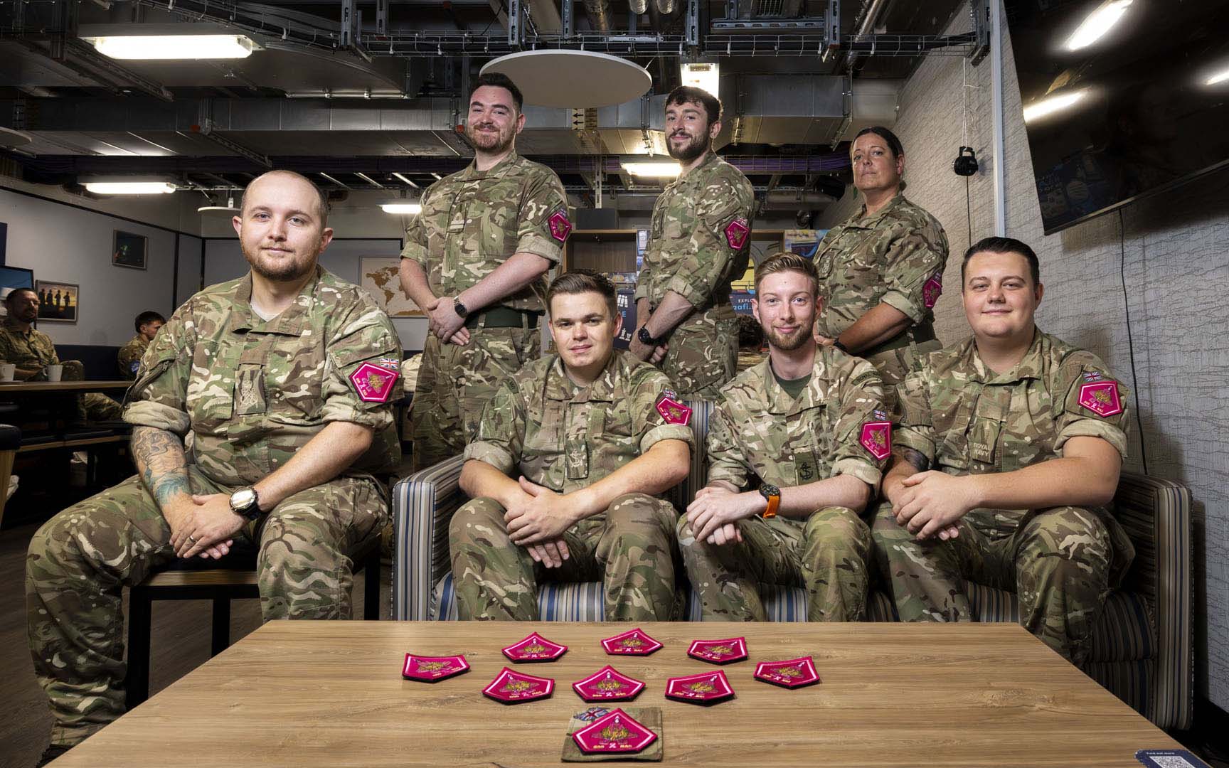 809 NAS' memorabilia committee proudly display some of the pink patches
