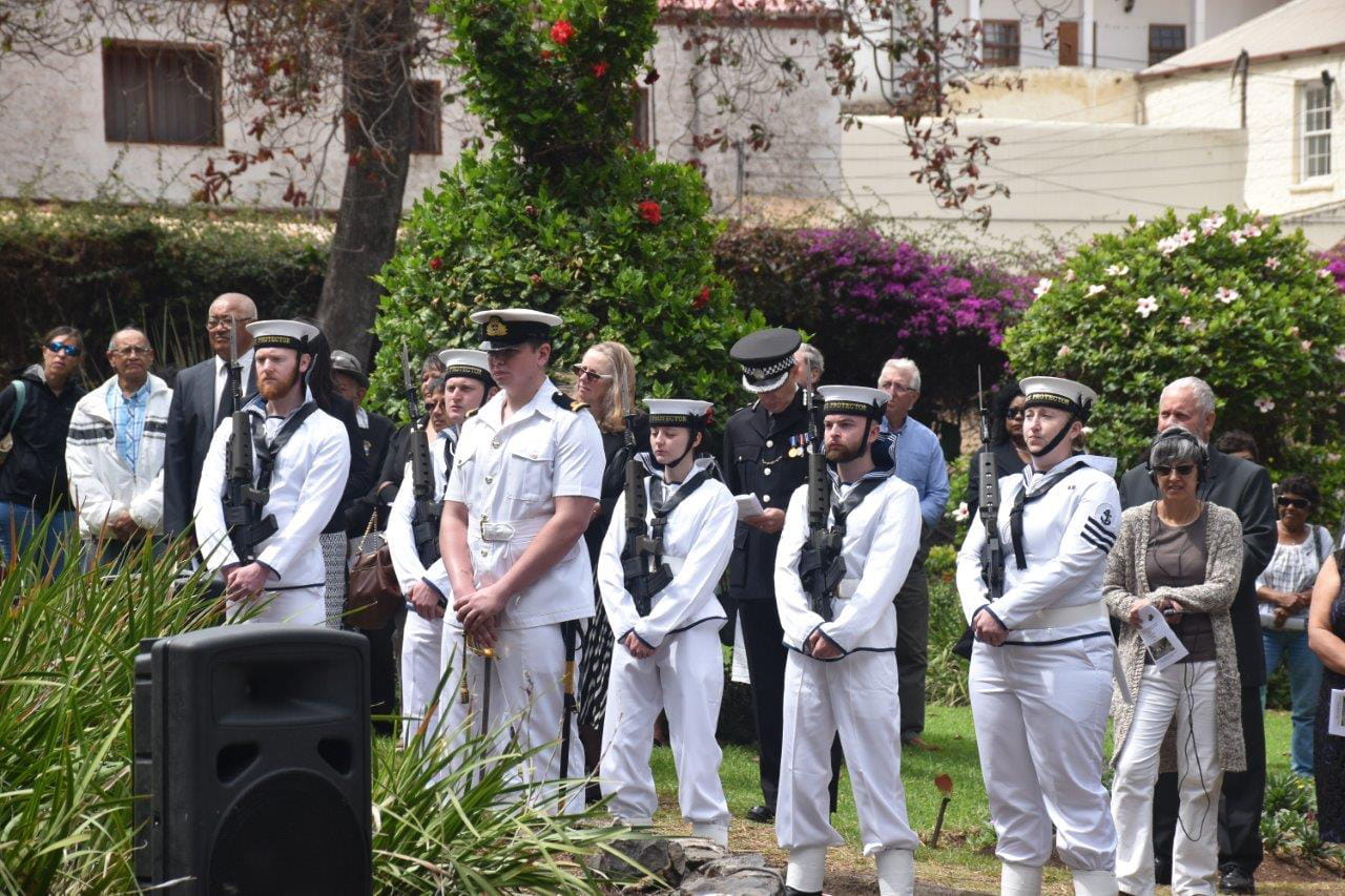 HMS Protector's Guard of Honour and islanders in the Castle Gardens memorial area to the fight against slavery