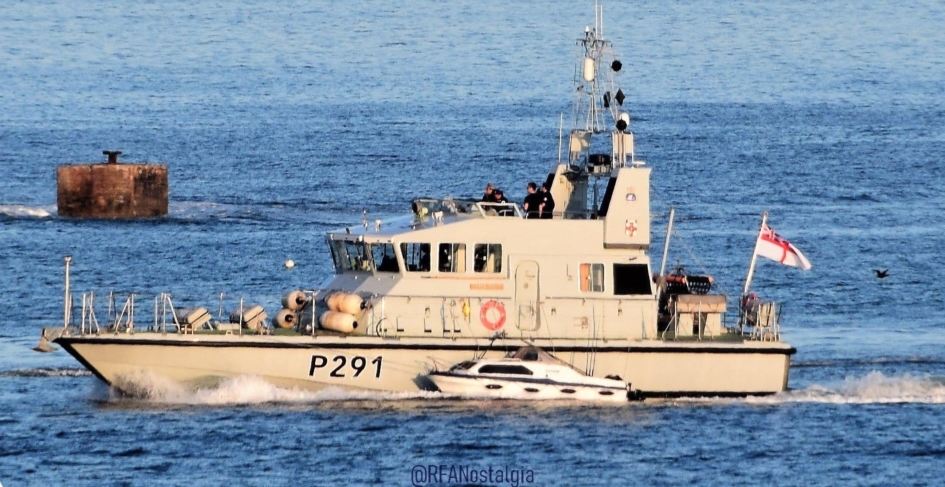 HMS Puncher helping a stricken fishing boat