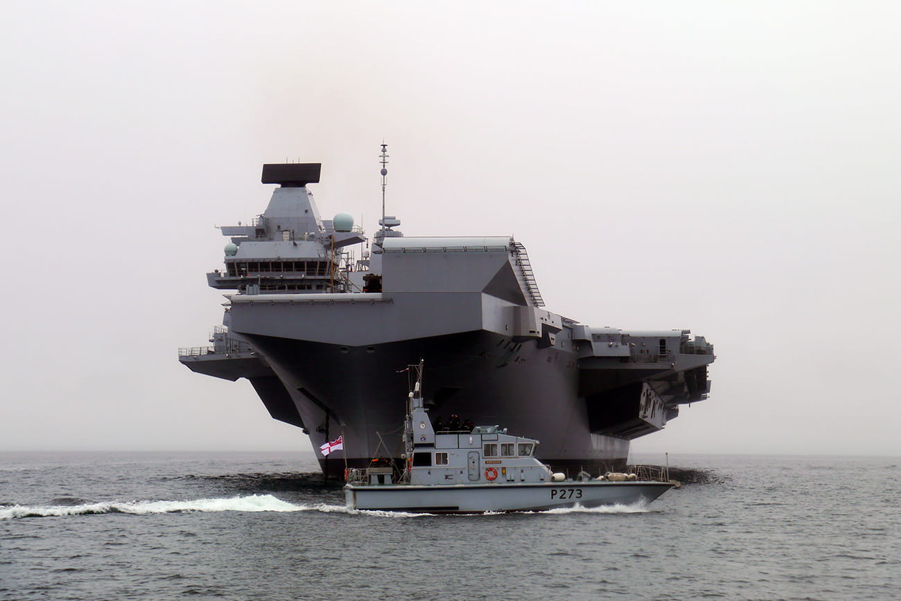 'Grey dwarf' as tiny patrol boats are overshadowed by gigantic HMS Queen Elizabeth