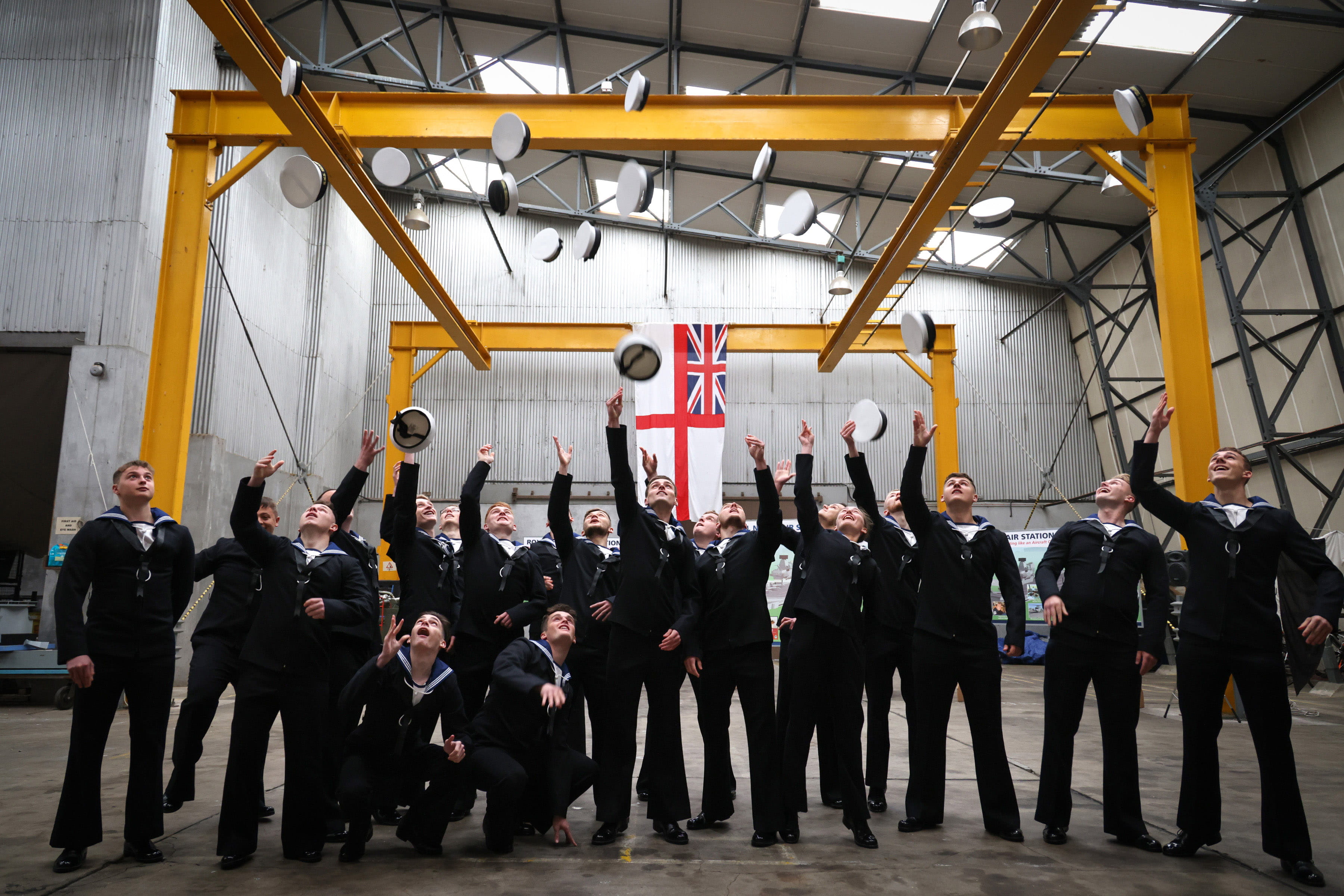 The newly-qualified Aircraft Handlers celebrate passing out from Culdrose
