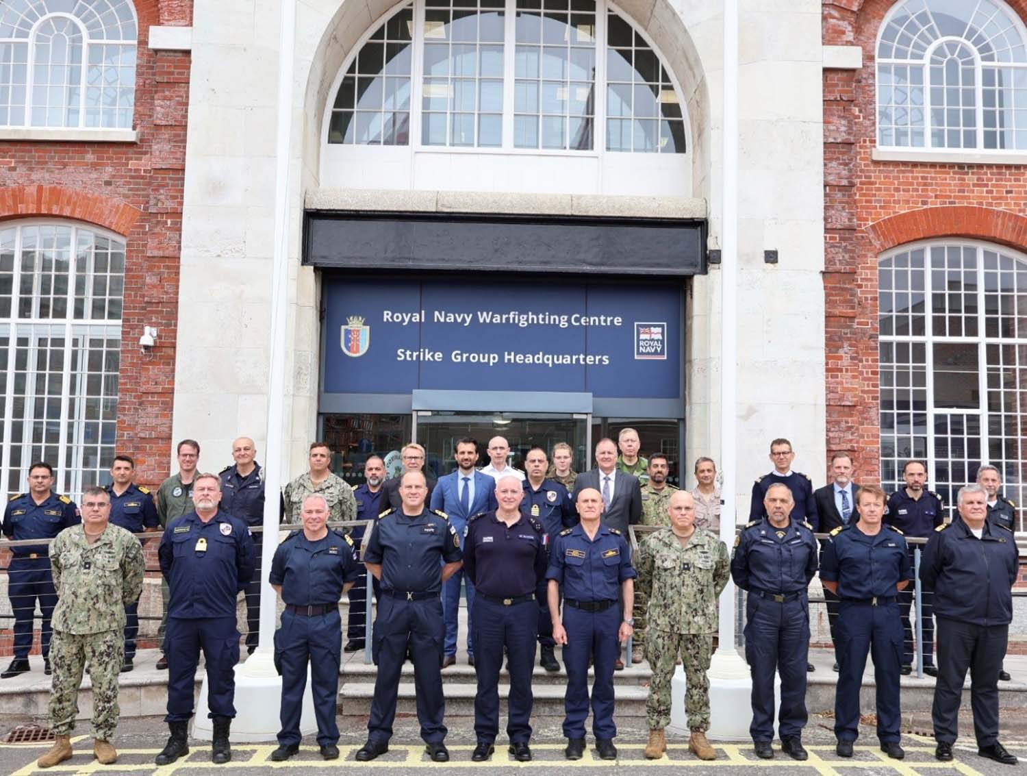 NATO contingent stood outside the Warfighting Centre in Portsmouth as part of meeting hosted by Rear Admiral Rob Pedre