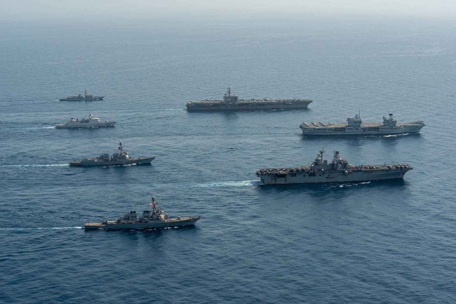 HMS Queen Elizabeth meets up with the USS Ronald Reagan carrier strike group and USS Iwo Jima amphibious ready group for training in the Gulf of Aden. Picture: Seaman Gray Gibson/US Navy