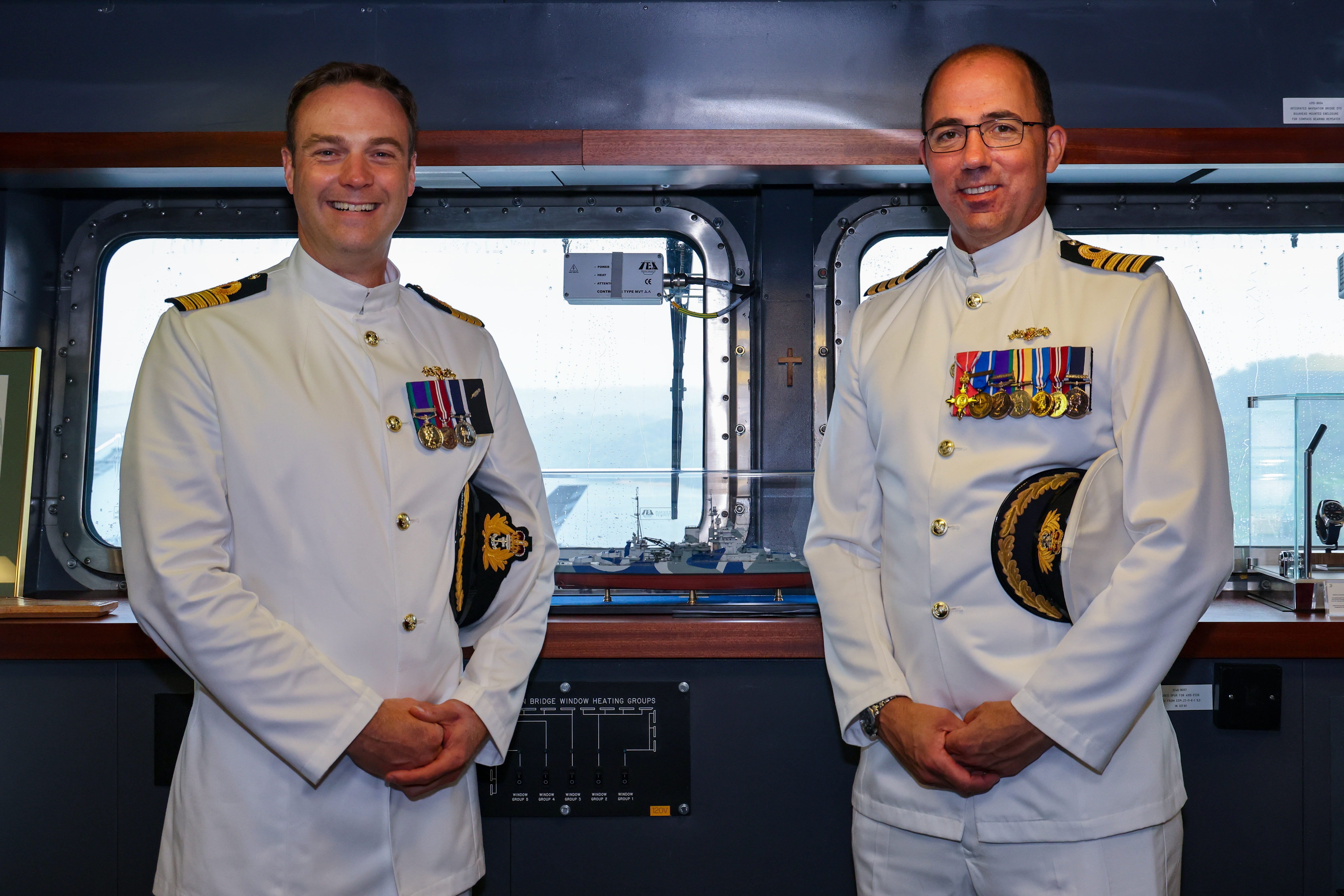 Captain Ian Feasey has taken over Captain Angus Essenhigh as commanding officer of HMS Queen Elizabeth. Picture: POPhot Jay Allen