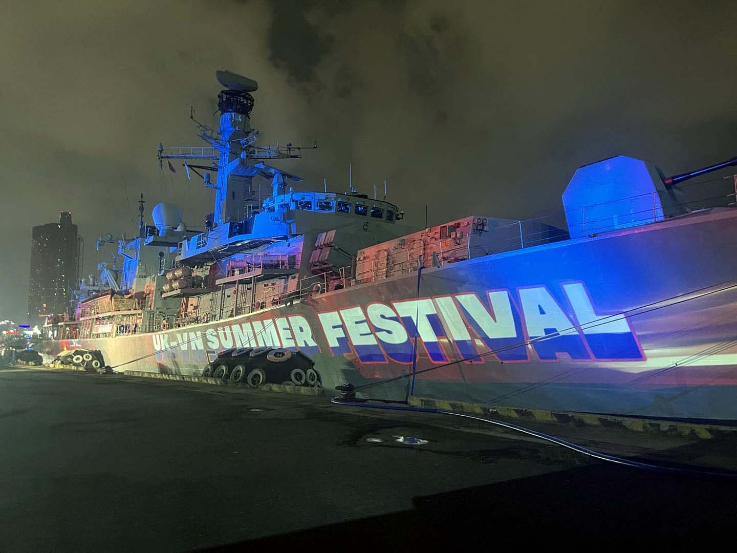 HMS Richmond lit up at night in Ho Chi Minh City