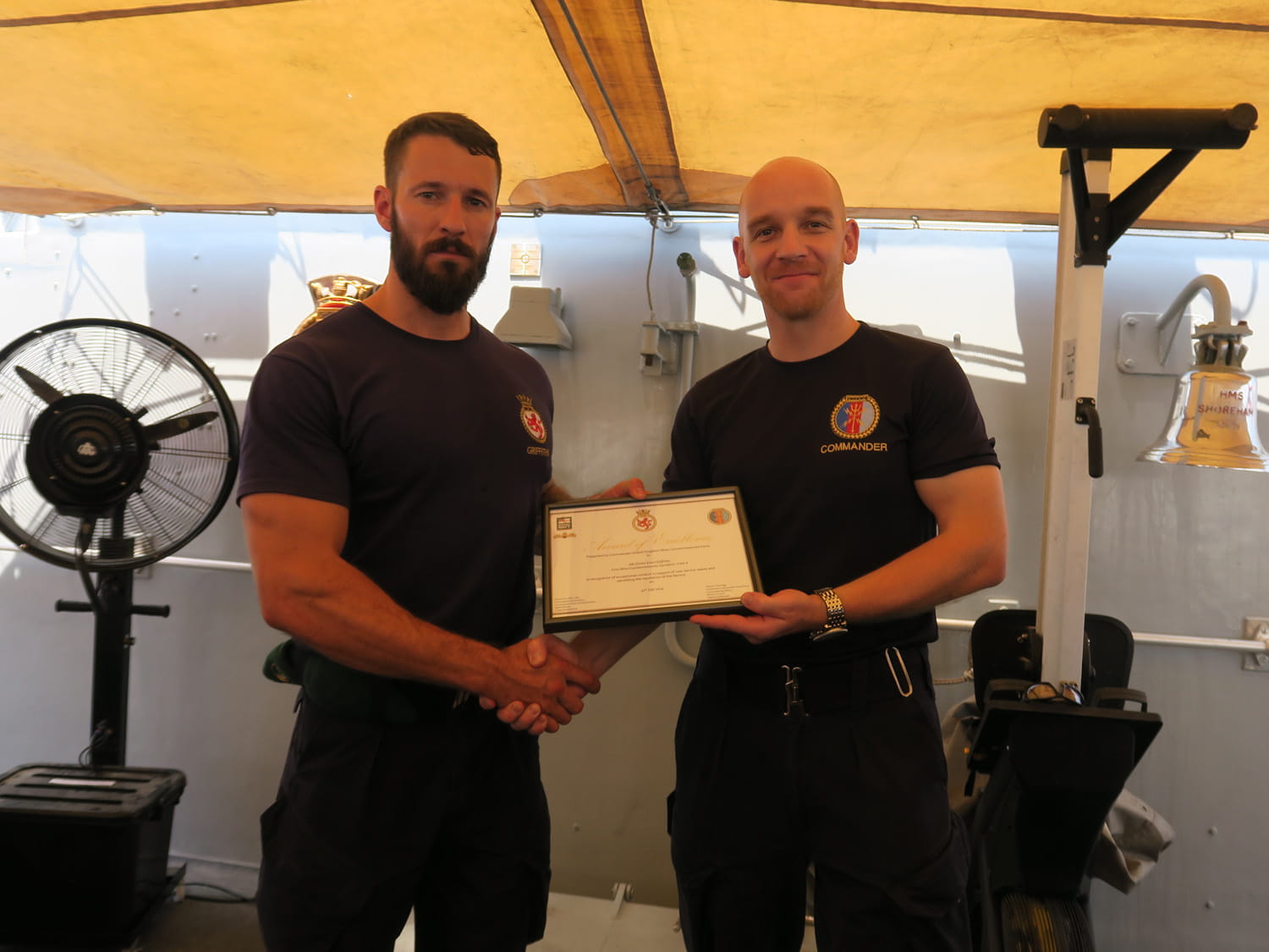 AB Griffiths (left) receiving his commendation.