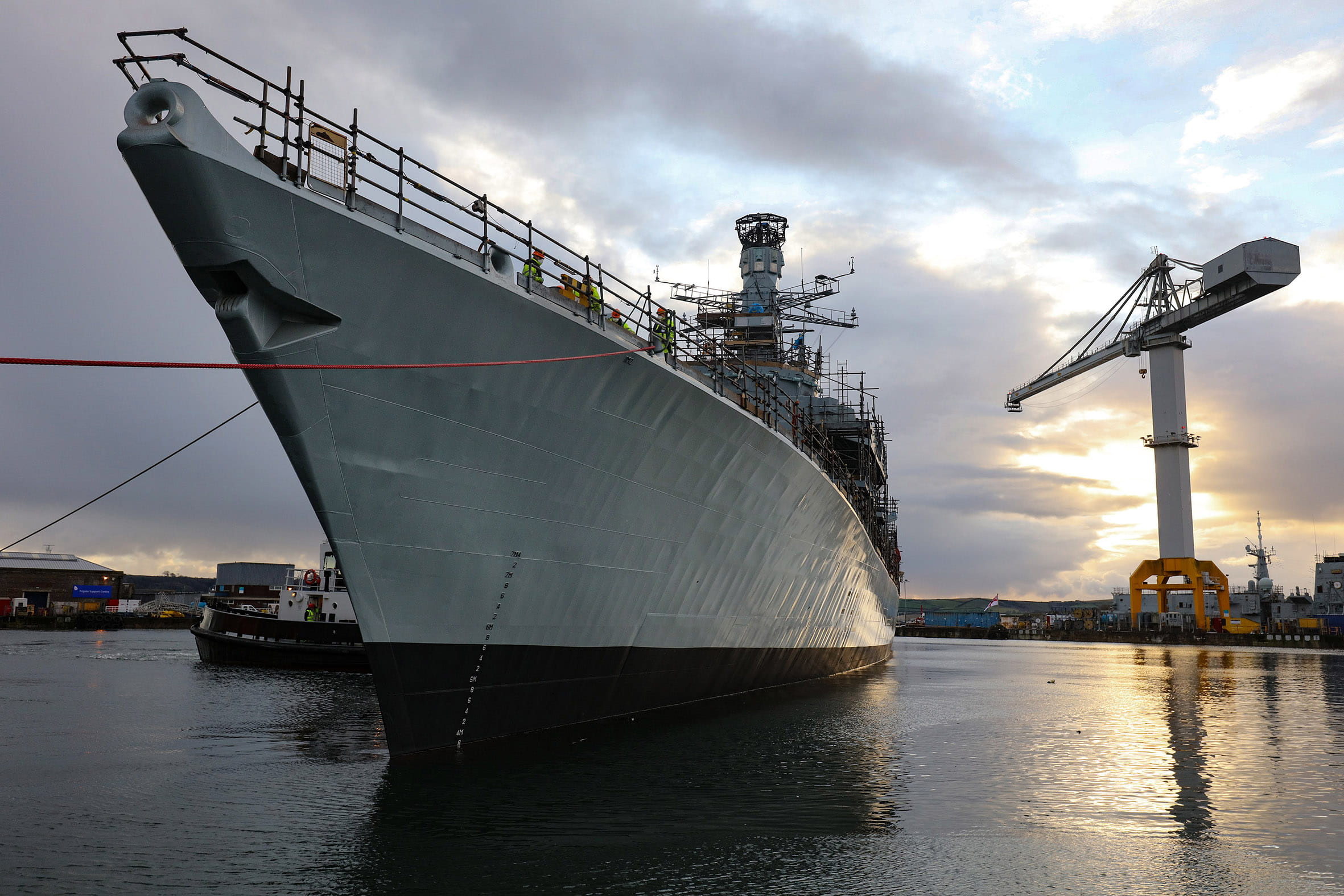 HMS Somerset is manoeuvred by a tug after emerging from the refit shed HMS Somerset is manoeuvred by a tug after emerging from the refit shed