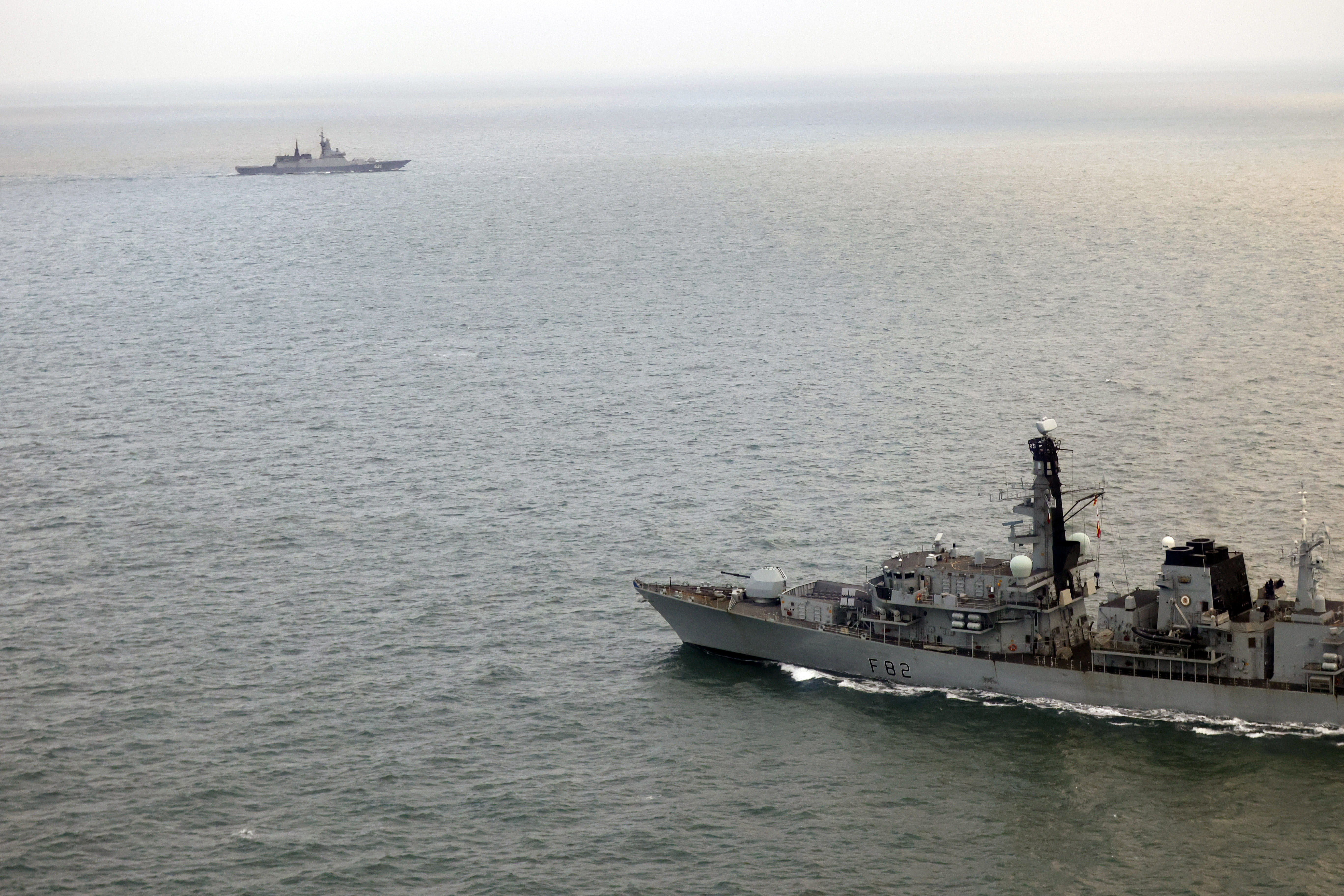 HMS Somerset (foreground) maintains watch on Russian corvette RFS Soobrazitelny