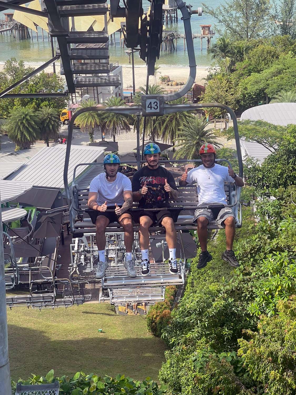 The engineers enjoy the sights on a ski lift
