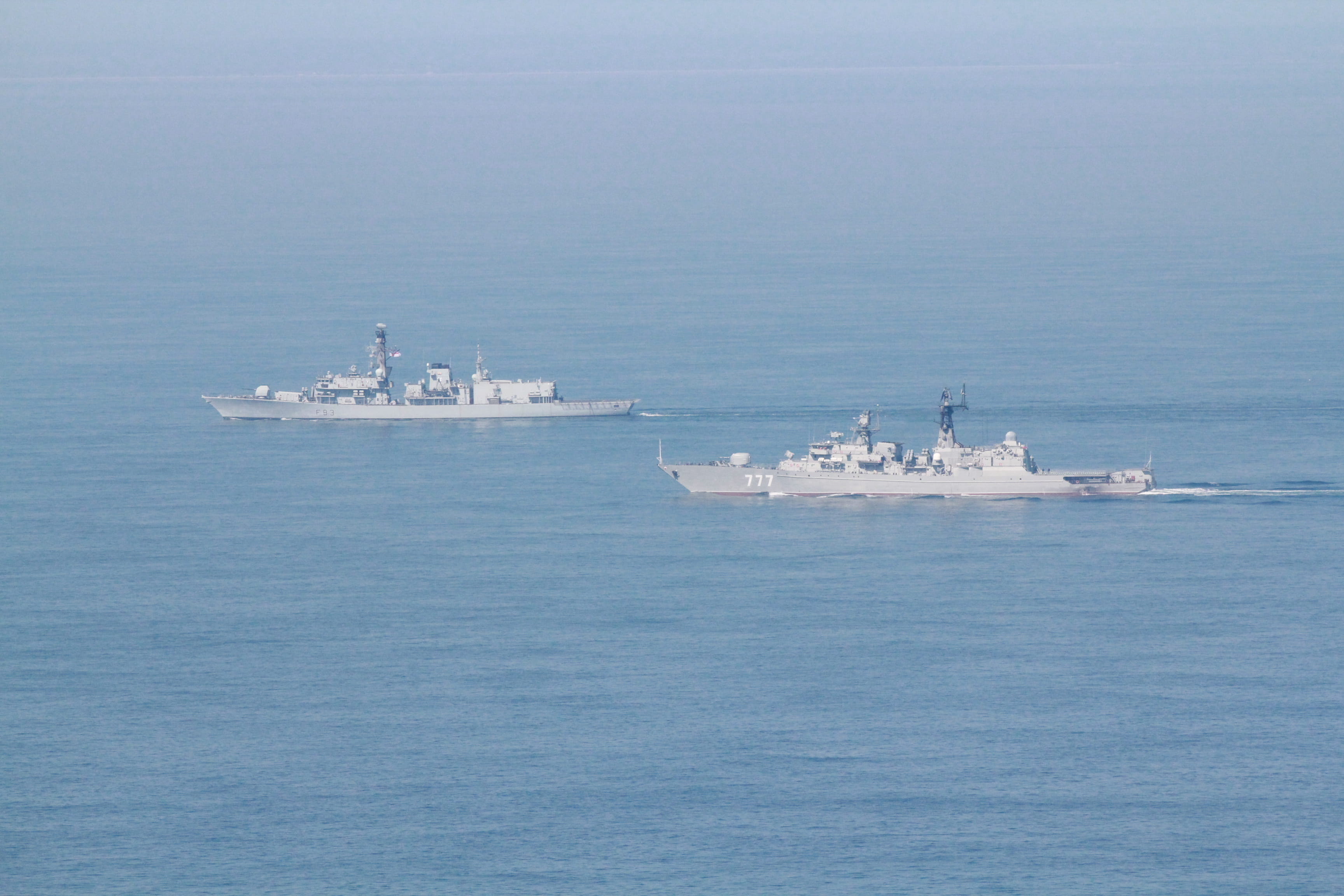 HMS St Albans (background) monitors the Russian frigate Yaroslav Mudry in the English Channel