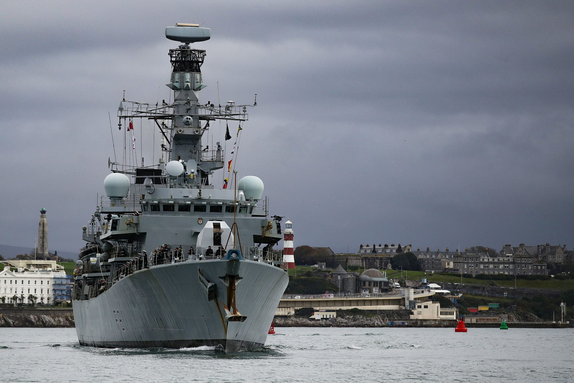 A gunmetal HMS Sutherland on a gunmetal day in Plymouth with the Hoe in the background A gunmetal HMS Sutherland on a gunmetal day in Plymouth with the Hoe in the background