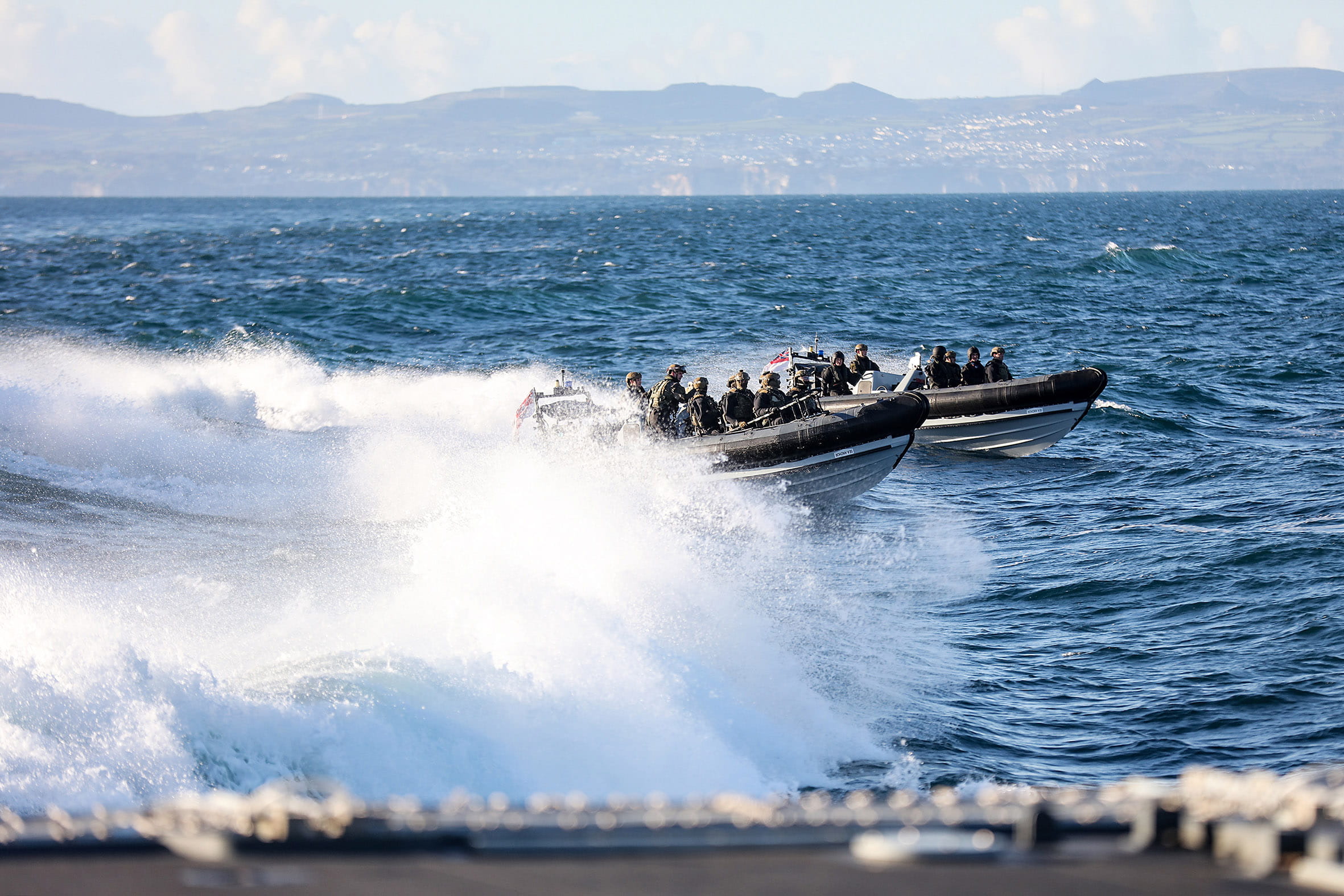 The boarding and search team races through Plymouth Sound at high speed in two RIBs