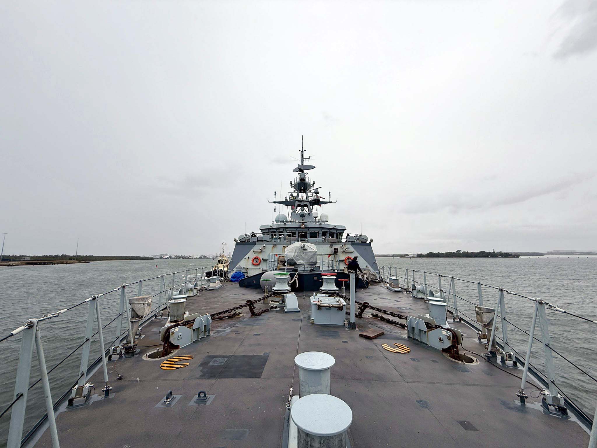 A view down the forecastle as HMS Tamar leaves Brisbane