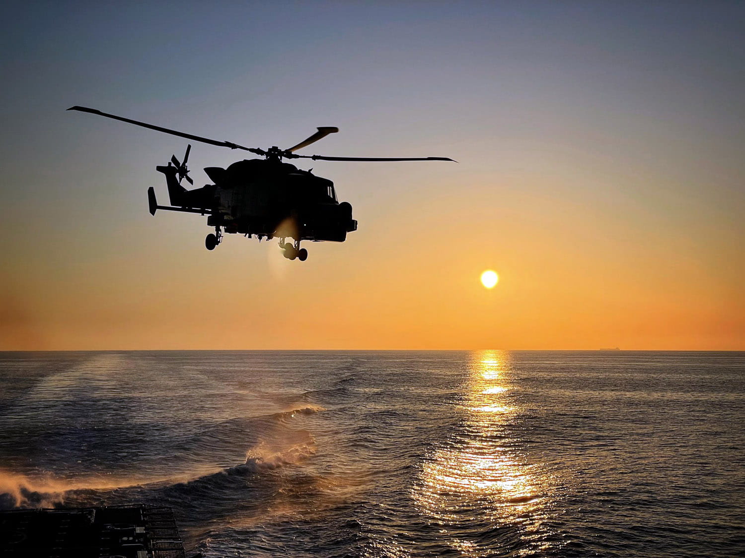 Wildcat - callsign Gauntlet - is silhouetted against the setting Med sun Wildcat - callsign Gauntlet - is silhouetted against the setting Med sun