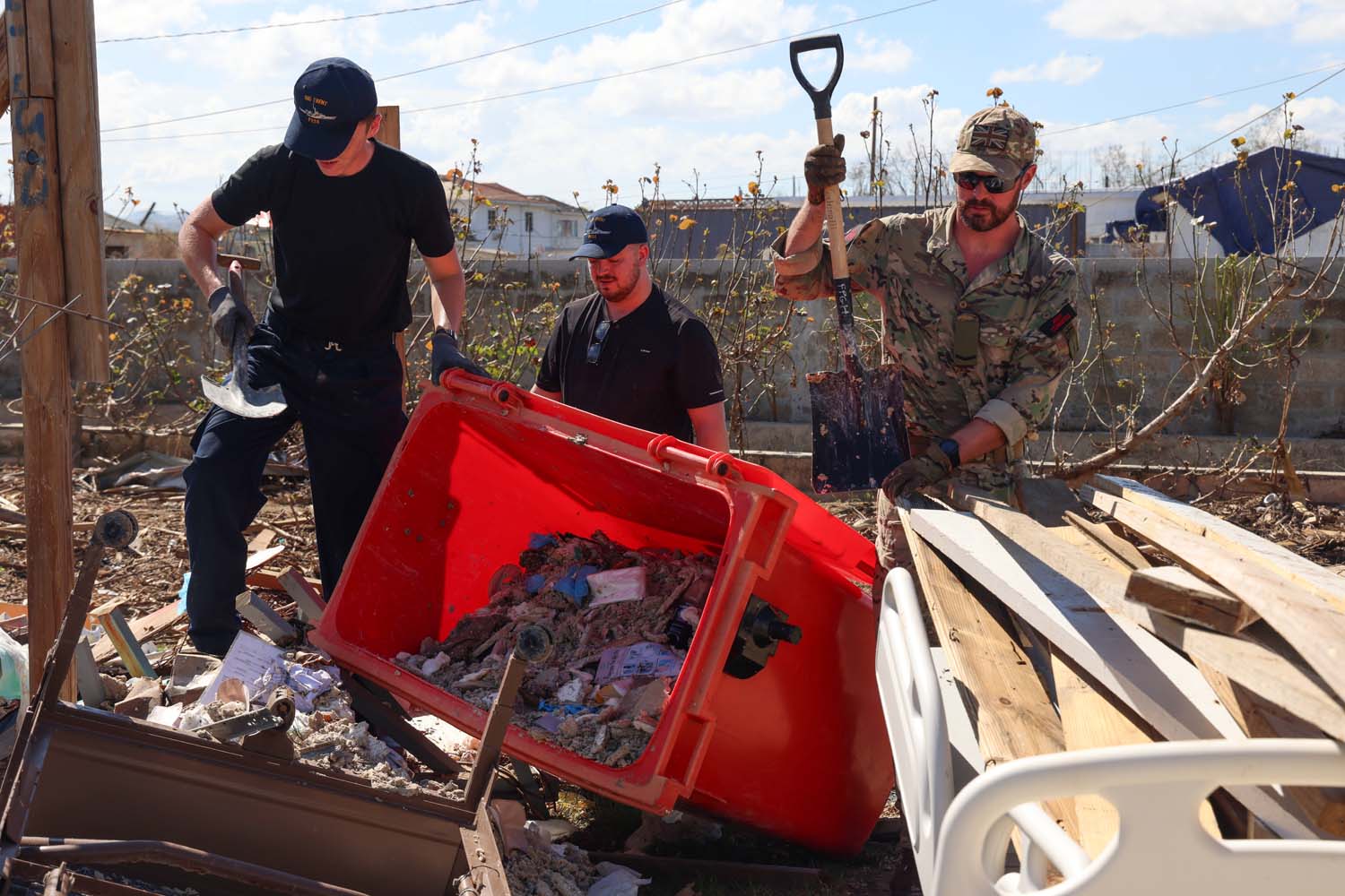 Personnel from HMS Trent clean up the hospital site in Falmouth, Jaimaica
